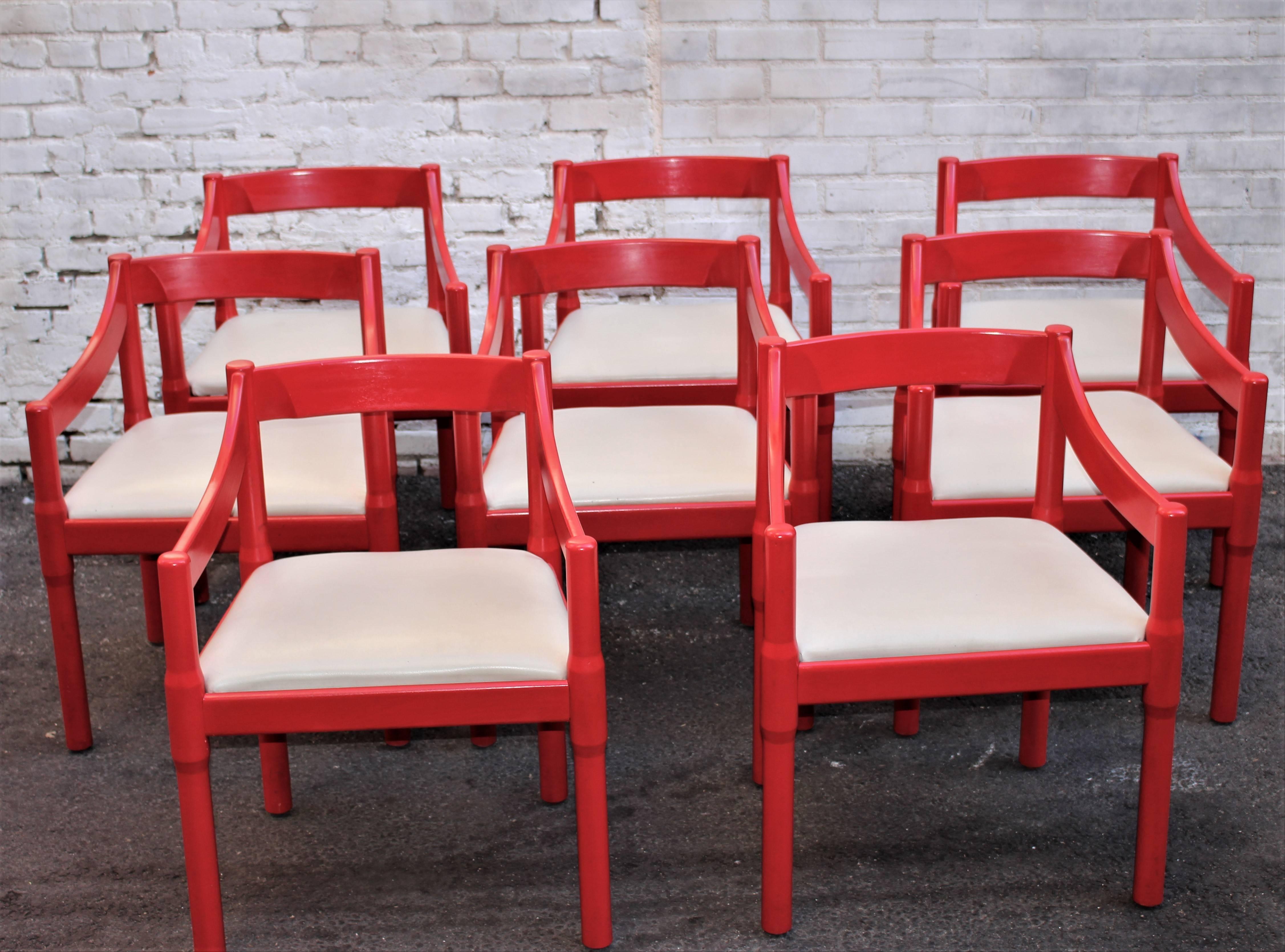 Red chairs buy Vico Magistretti (Carimate 1963) Seat are cover with the vinyl upholstery.