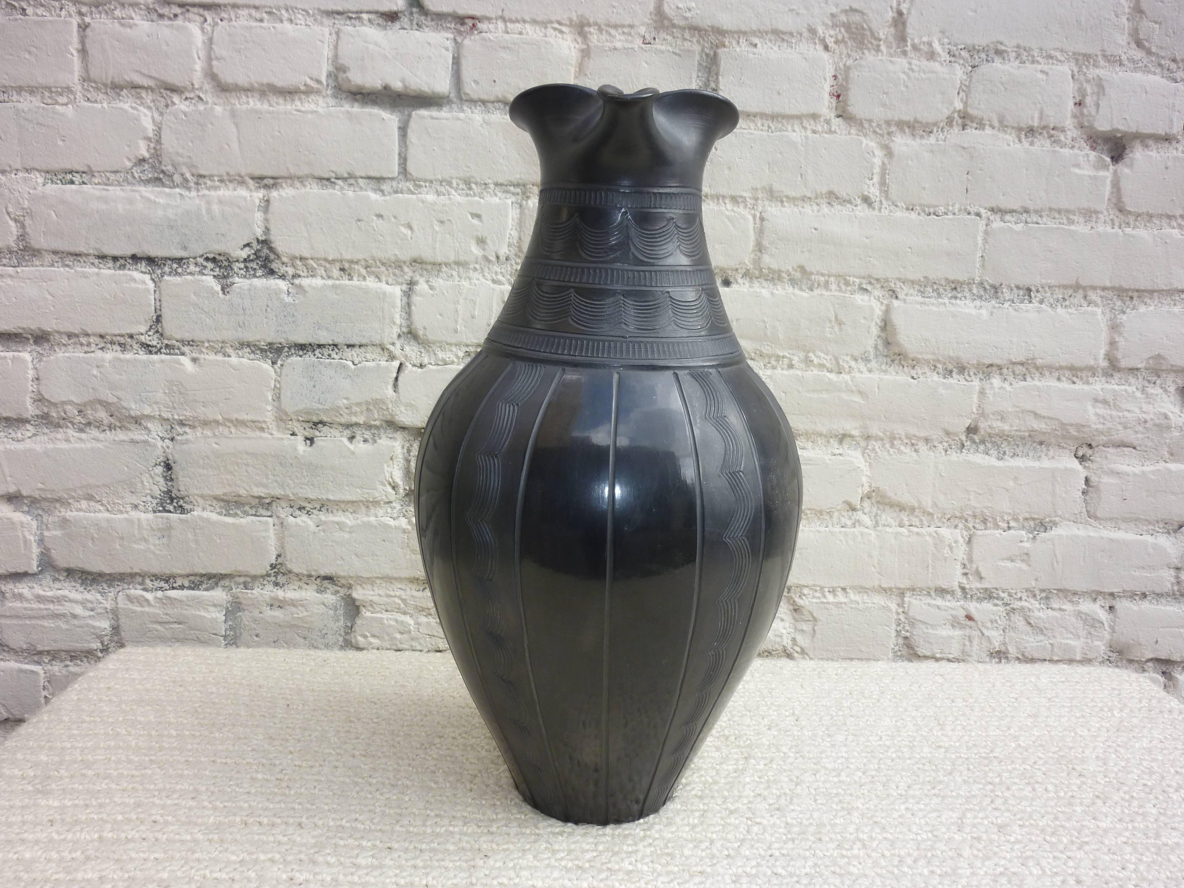 Large black color jar.