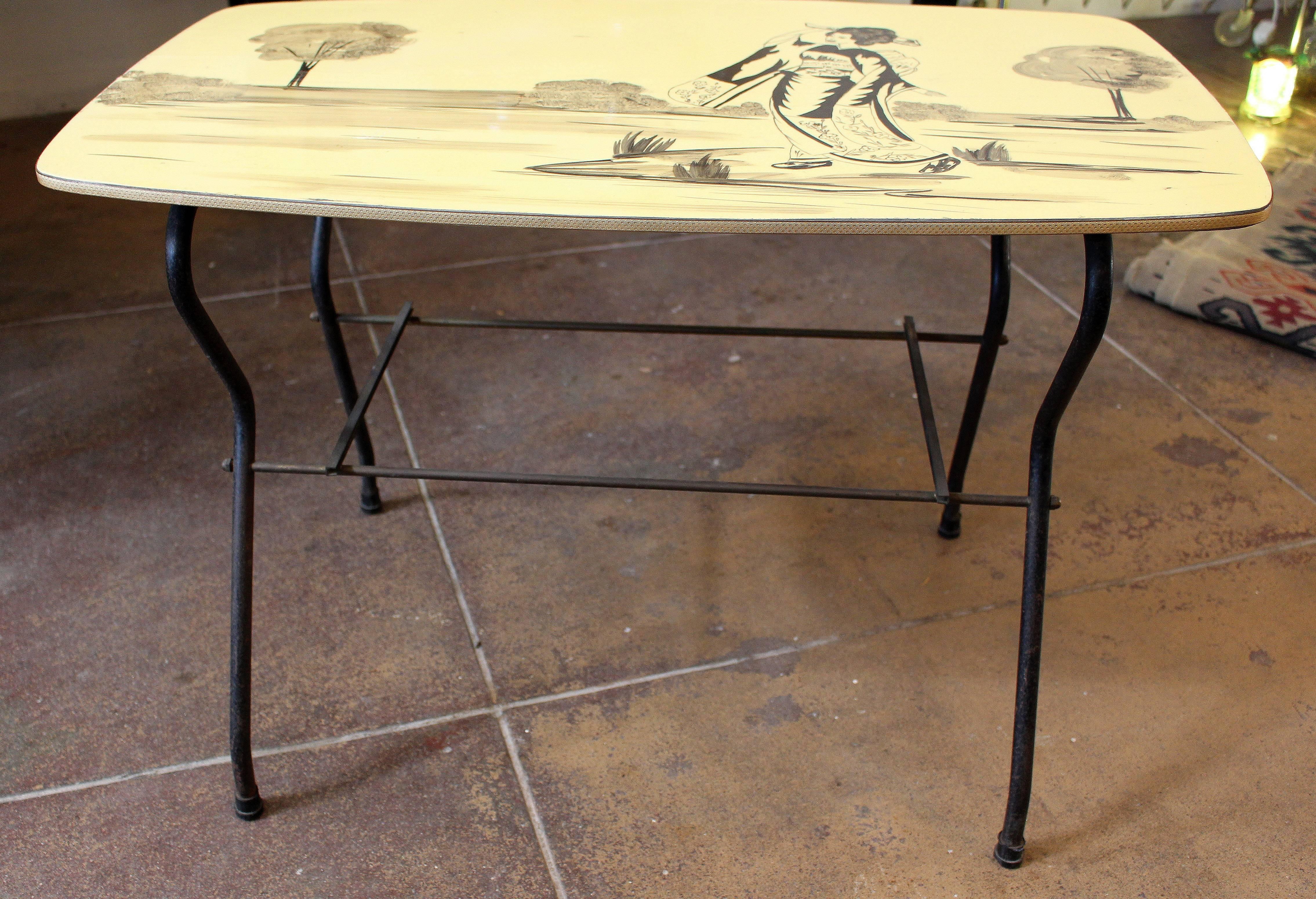 Mid-Century Italian coffee table. Metal and brass base glass shelf in the middle. Parchment top.