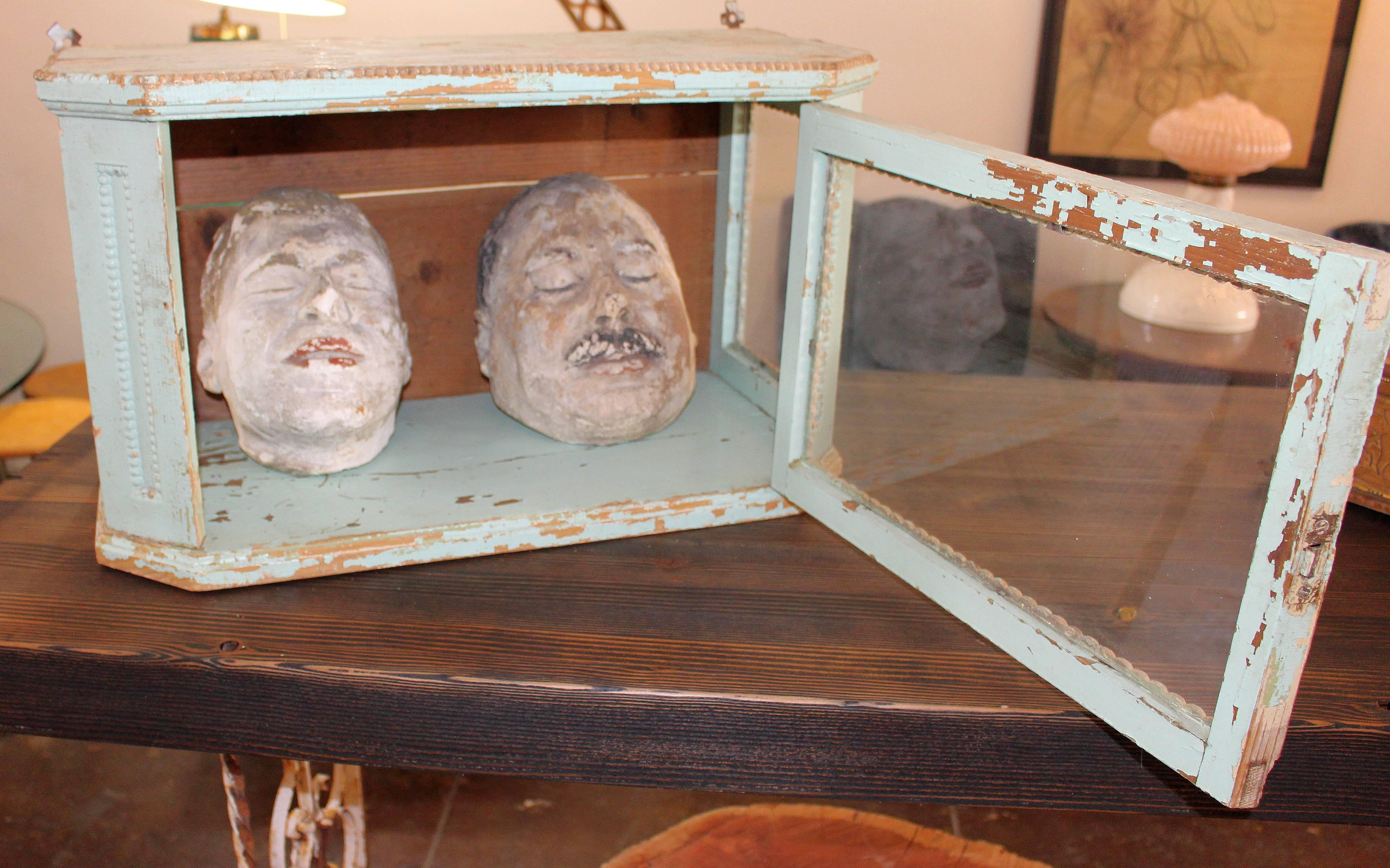 
 Italian set of Five death mask 

Italian death mask cast, circa 1930s. Showing in the 19th century glass country cabinet.The price is only for the mask the cabinet is not available. All the masks are different size.
The 3 smaller mask are from the