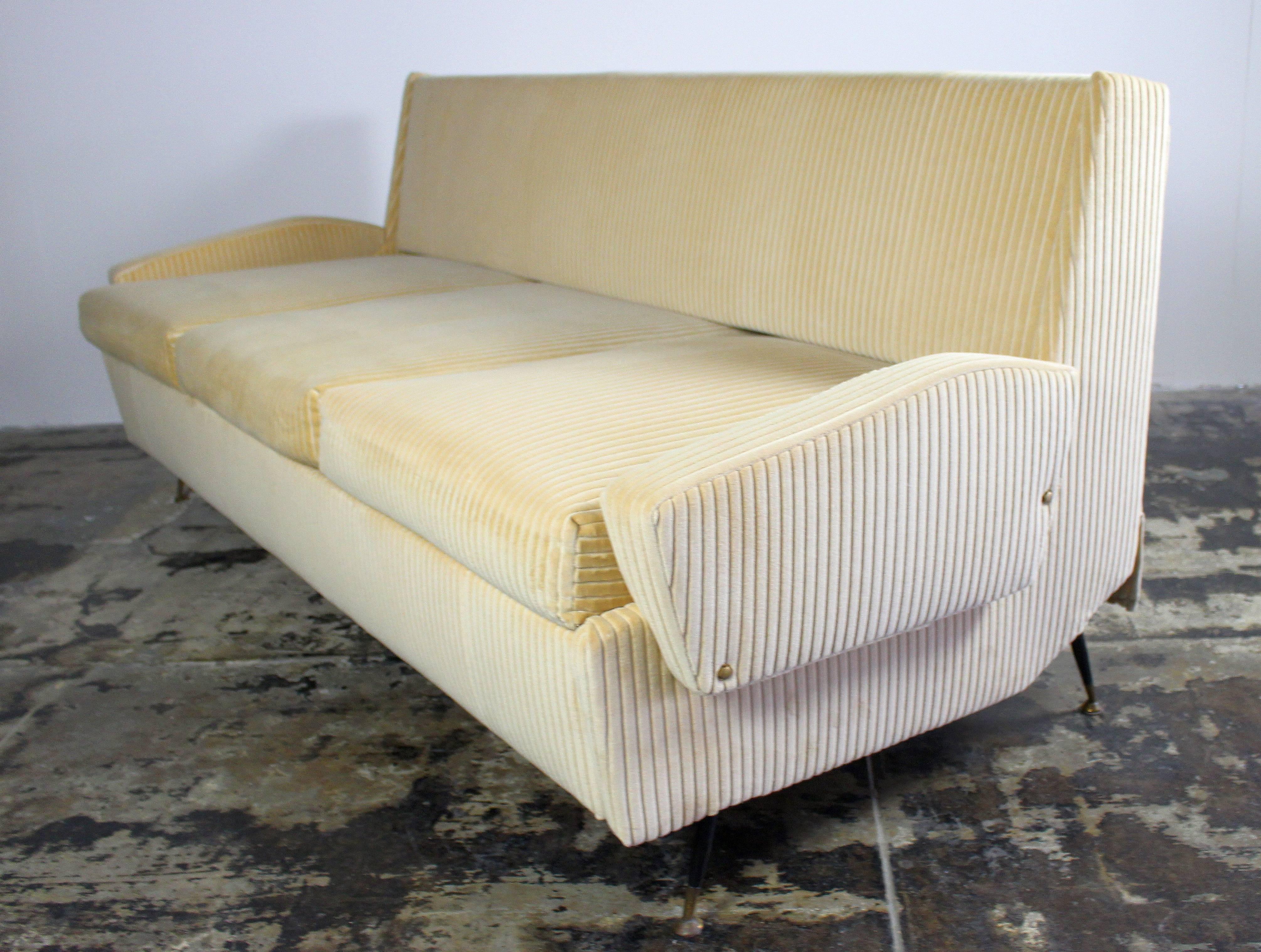 1950s original Italian sofa refurbish and reupholstered with the panna cotta corduroy cotton velvet, and new foam. Sofa and the bed very comfortable .Brass and metal lags
when the bed extended length is 80 inches and depth 31.5 inches.