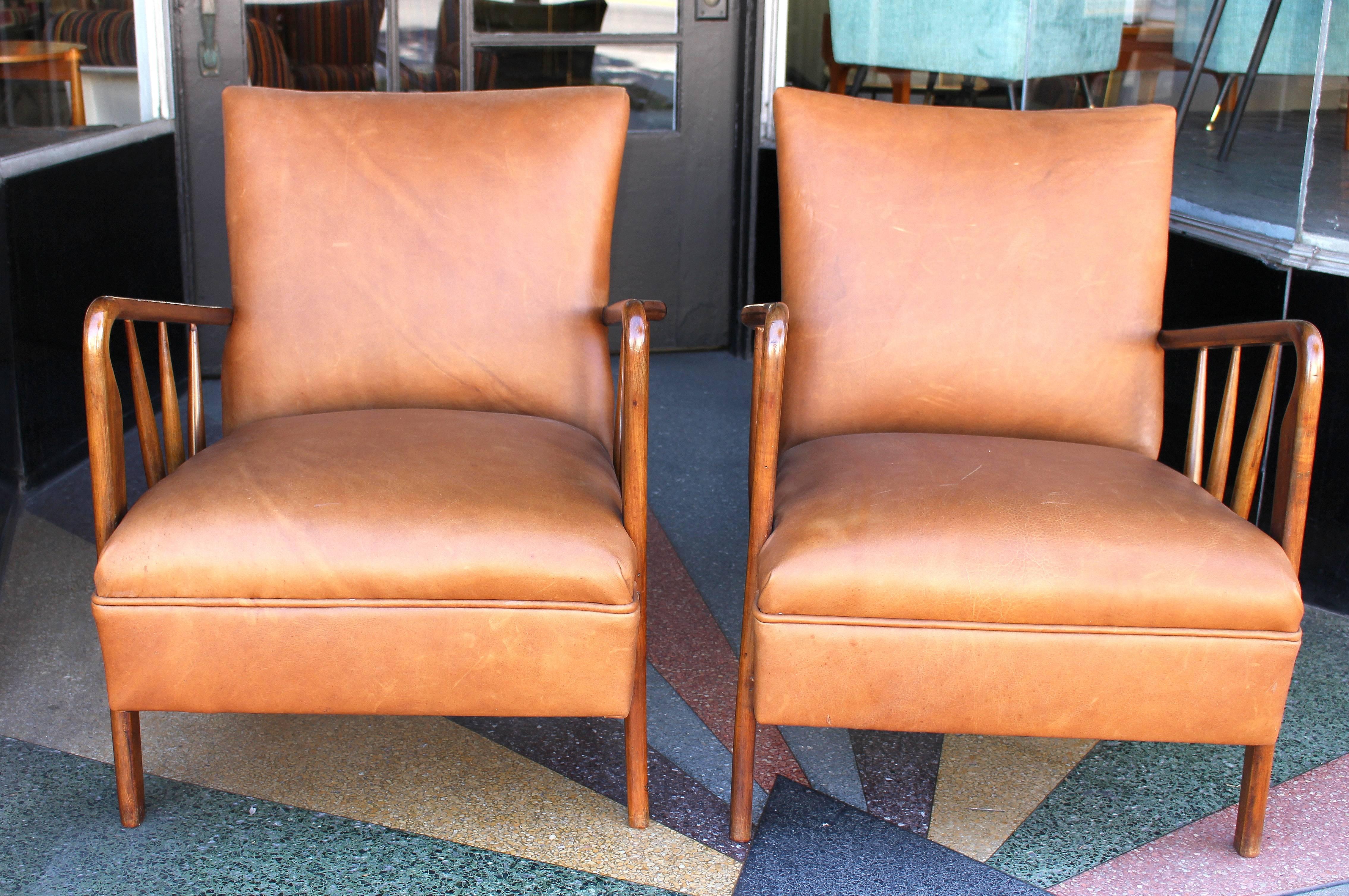 
Italian leather pair of chairs new reupholstered and lacquered fruit wood.
Bronze boots on the end of the arms like shown on the photo.
  