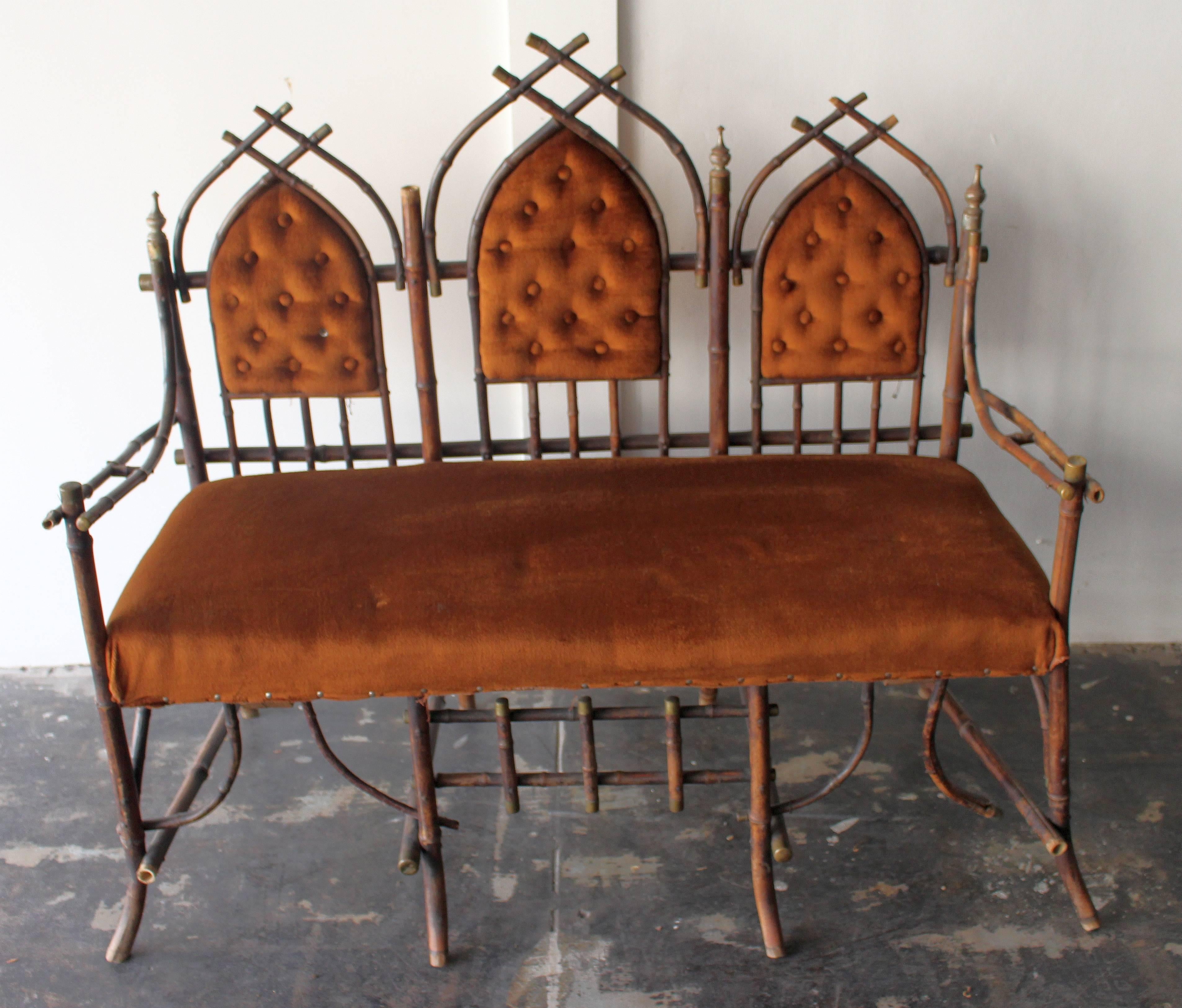19th century French Victorian bamboo settee and  Chinoiserie  with the extendible  leaves.  Settee base is bamboo and brass boots,  upholstery is velvet and Chinoserie extensio have  hand painted tails, please note Chinoserie is missing 2 tails as