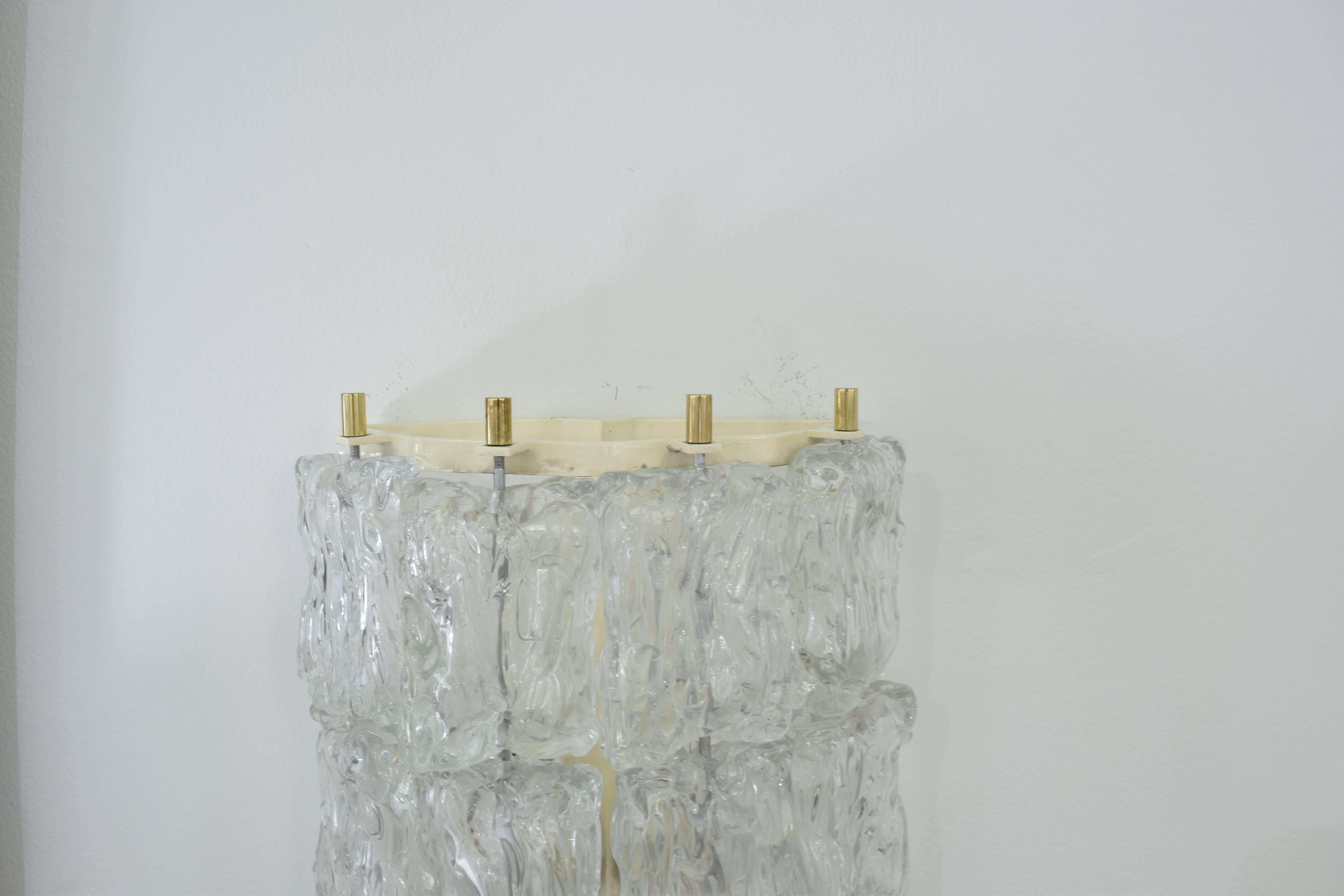 A midcentury Pair of Ice-Textured Sconces that has 16 crystals, and holds up to 240 watts.