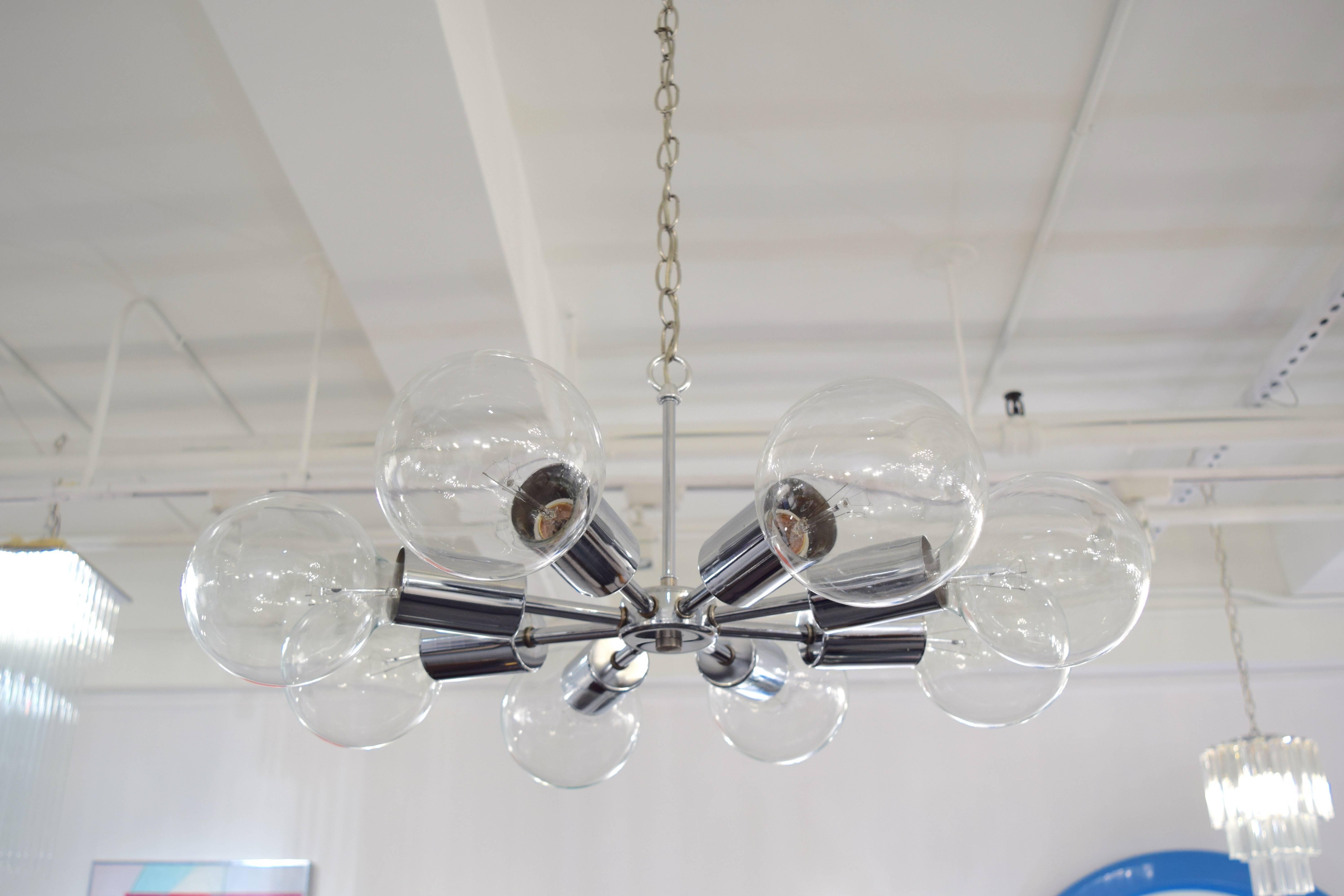 Amazing eight-arm Sputnik chandelier with a chrome finished frame. Fully rewired and ready to hang. Each socket takes a 25-60 watt bulb.