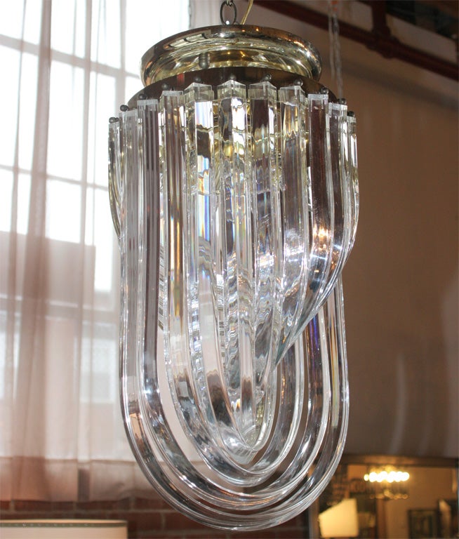 Flush mount sculptural Lucite and brass ribbon chandelier, just polished. Can be hung from chain as shown, but set up to be flush mount.