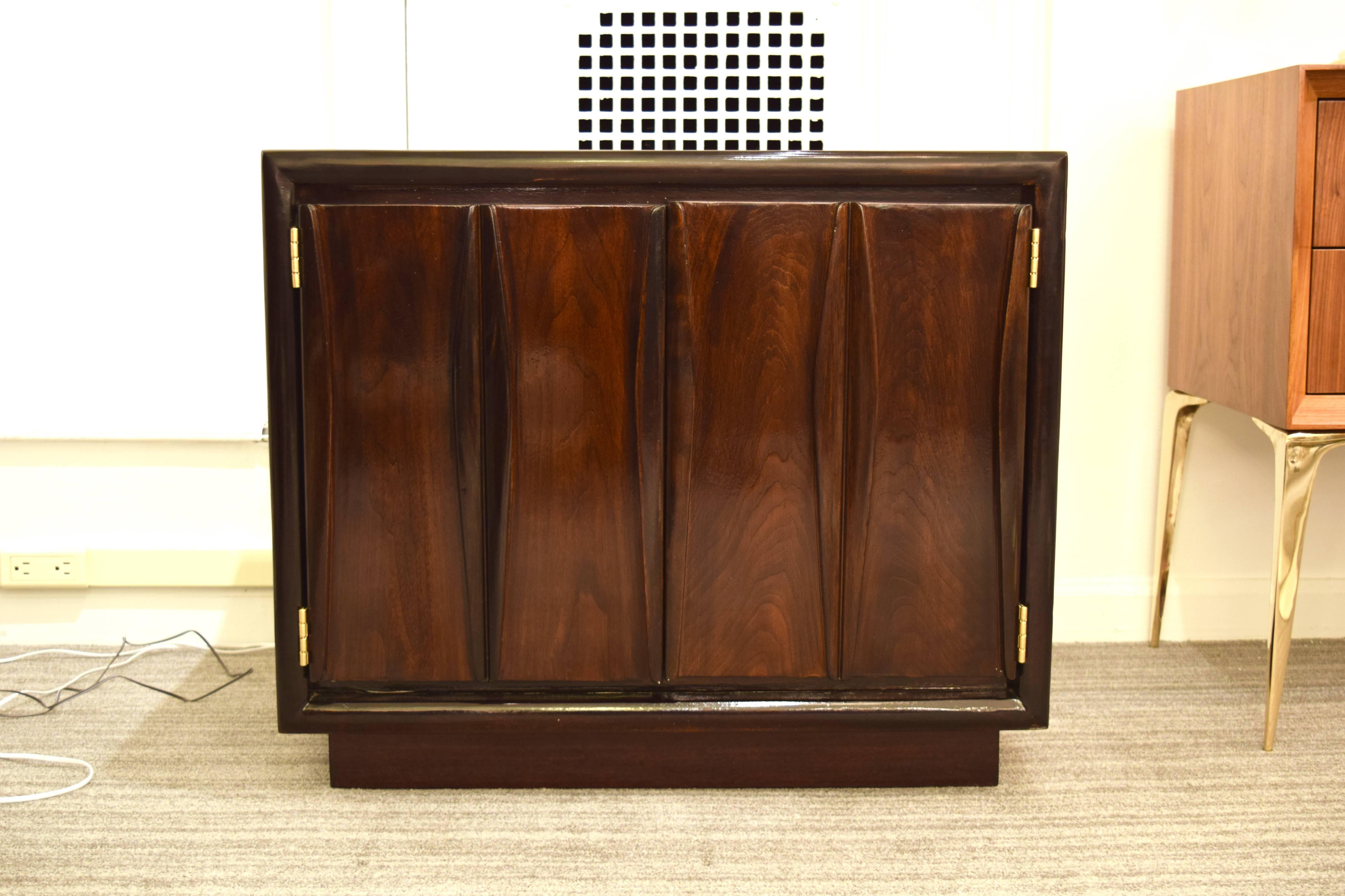 Pair of sculpted front double-door single drawer with open shelf small chests or end tables. Refinished in a deep walnut with extraordinary grain.