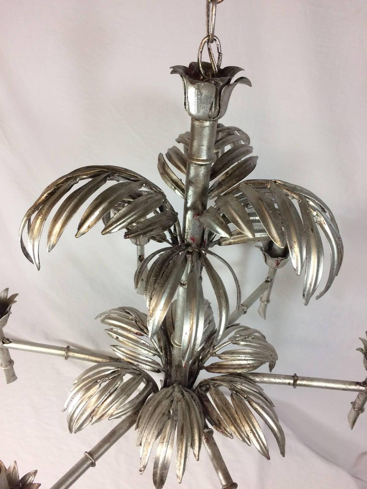 Six-arm silver leaf palm faux bamboo chandelier with matching ceiling cap.