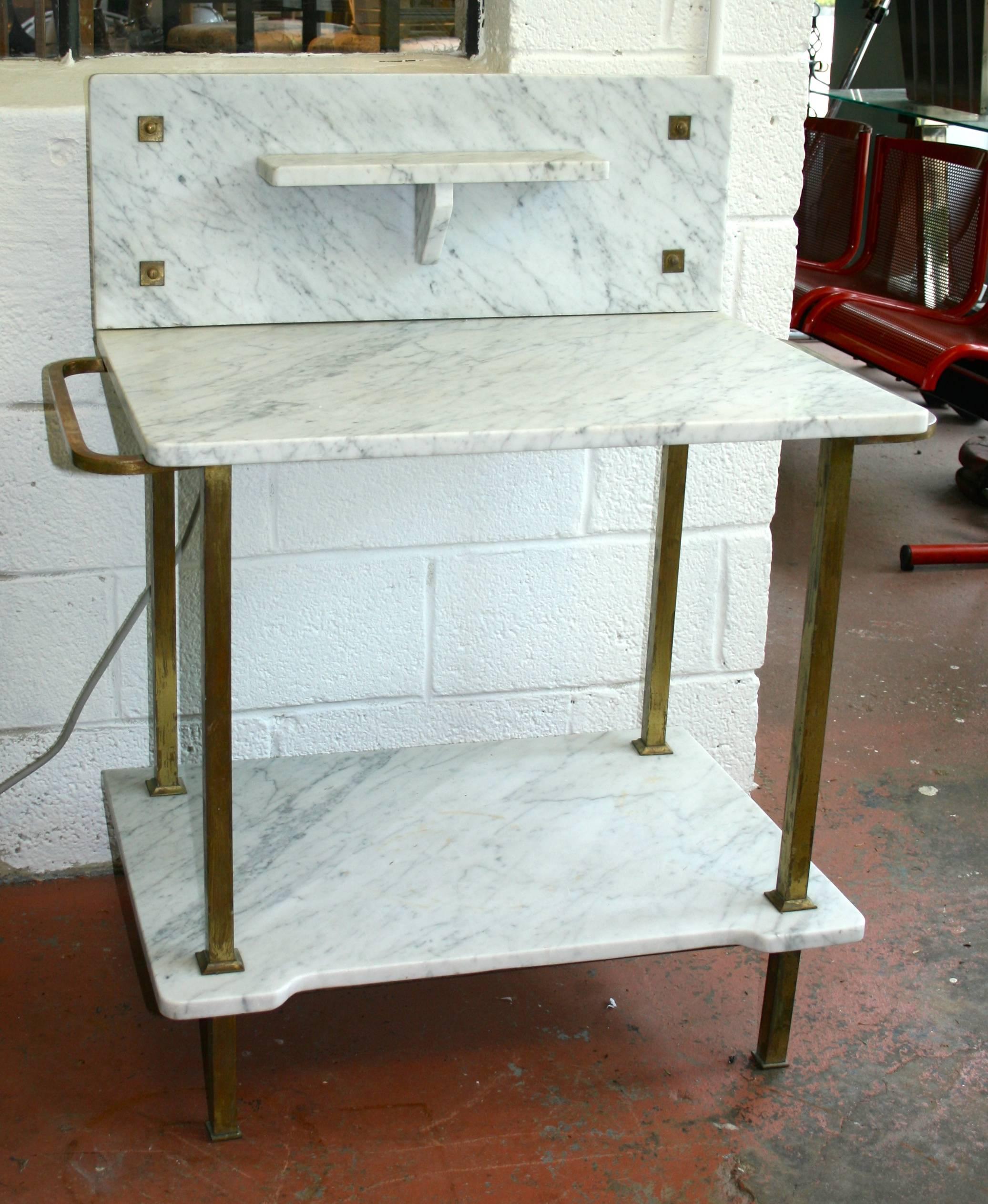 Tiered marble serving table with brass base and detail. Main surface is
29.75