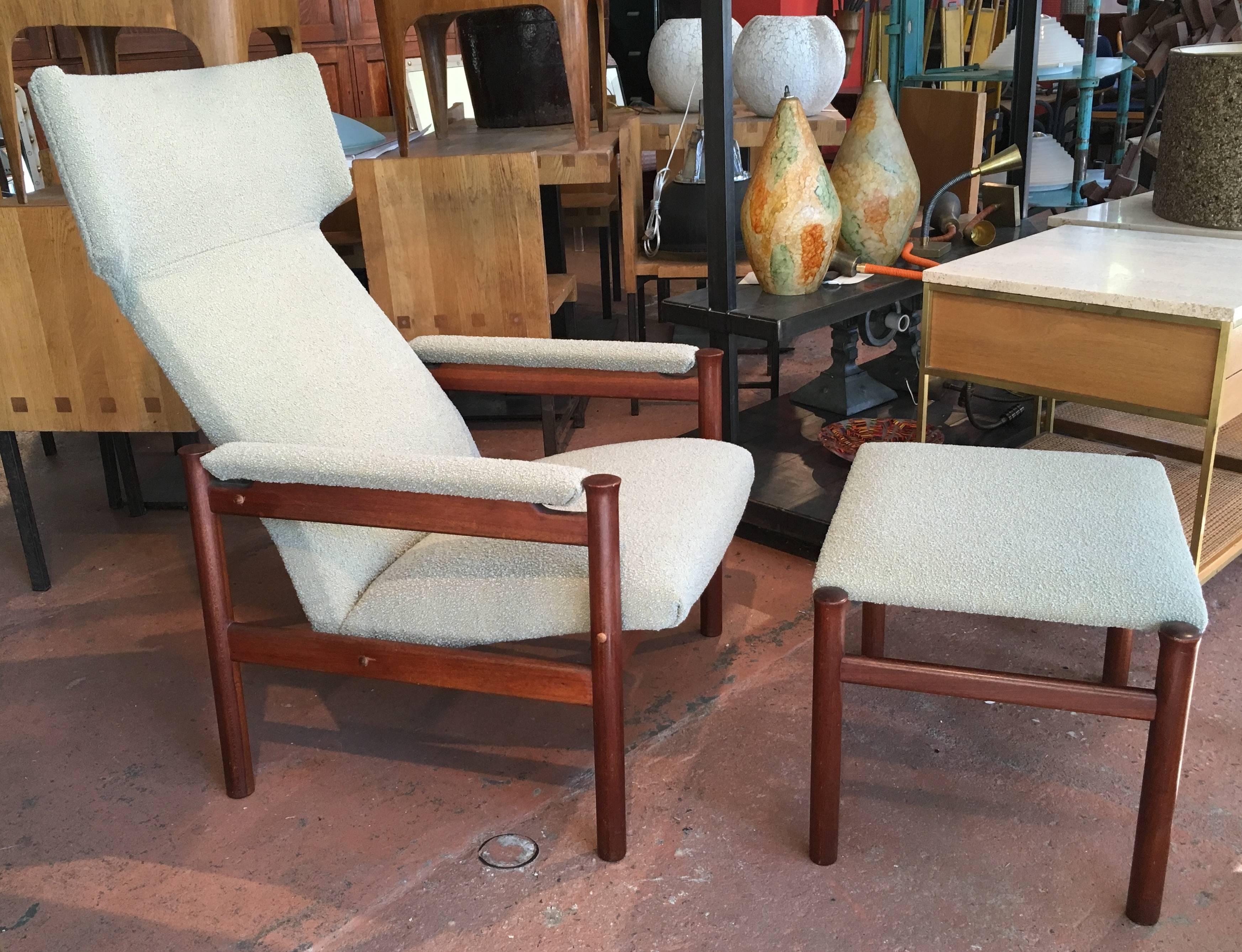 Rare example of the model '4365' chair designed by Soren Hansen in 1963 and produced by Fritz Hansen in 1967. Exaggerated wing chair with solid teak and frame and matching footstool; newer celadon bouclé upholstery.