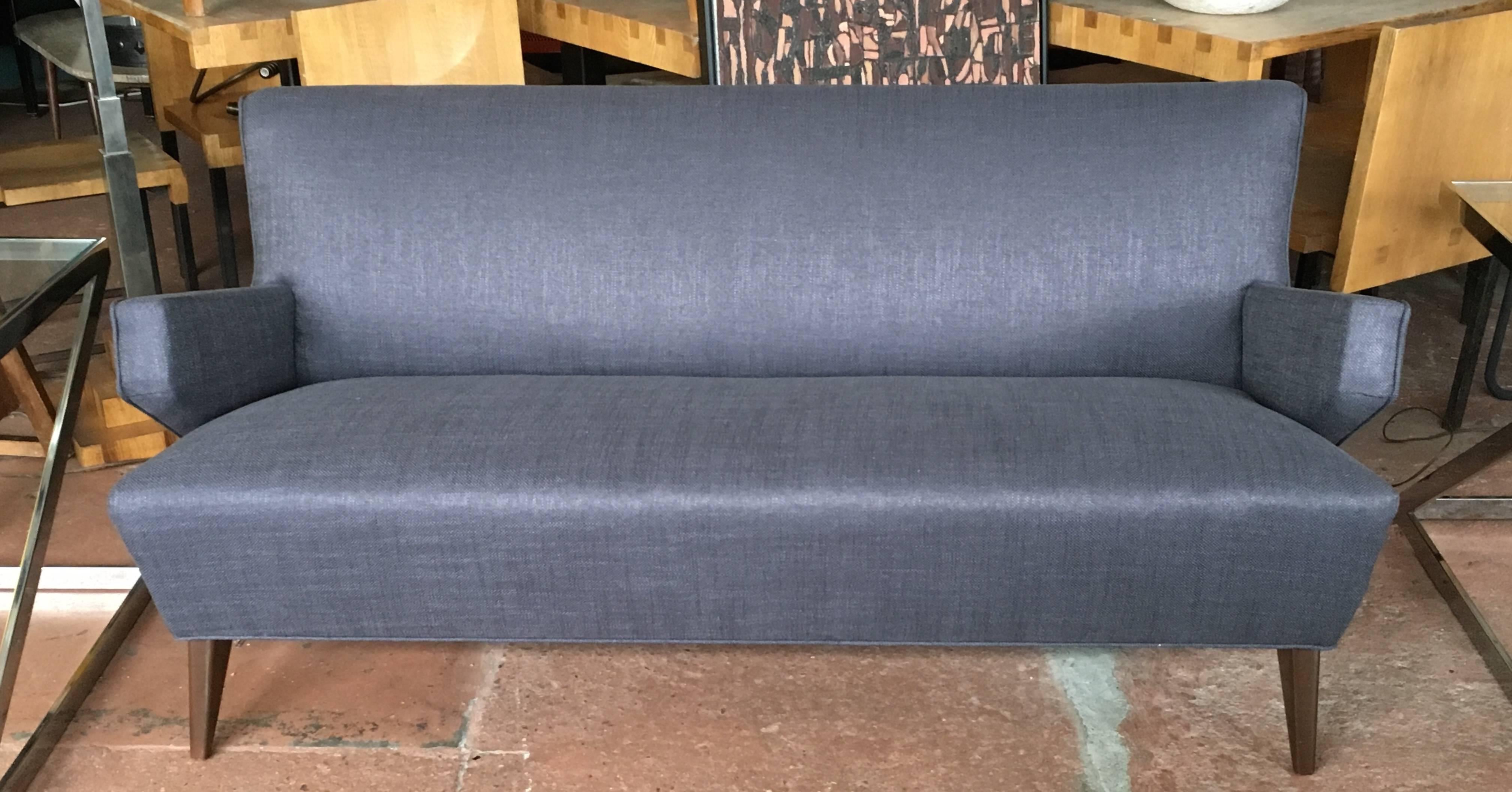 Original Jens Risom, Mid-Century sofa, newly upholstered in designer deep gray linen fabric.