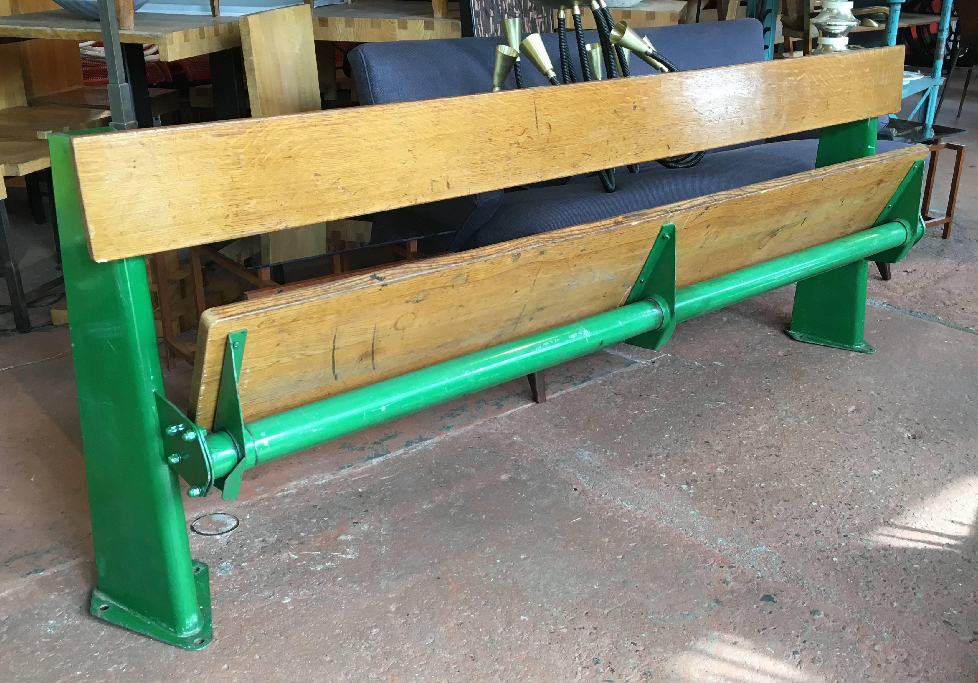 Rare Jean Prouve bench from the back row of the University of Paris Medical School Auditorium, circa 1957, in completely original condition, original green paint, single plank seat which fold up. This version is rare, only a handful made for the