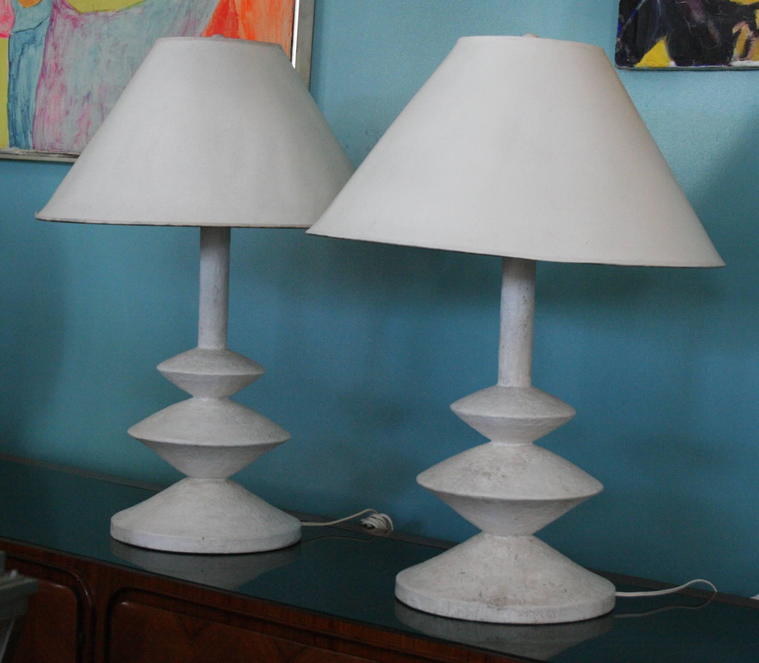 An iconic 20th century French design, pair of lamps originally designed by Giacometti for Jean Michel Frank, later produced by Grange for Yves Saint Laurent, these are early with a wonderful aged patina but difficult to document as original