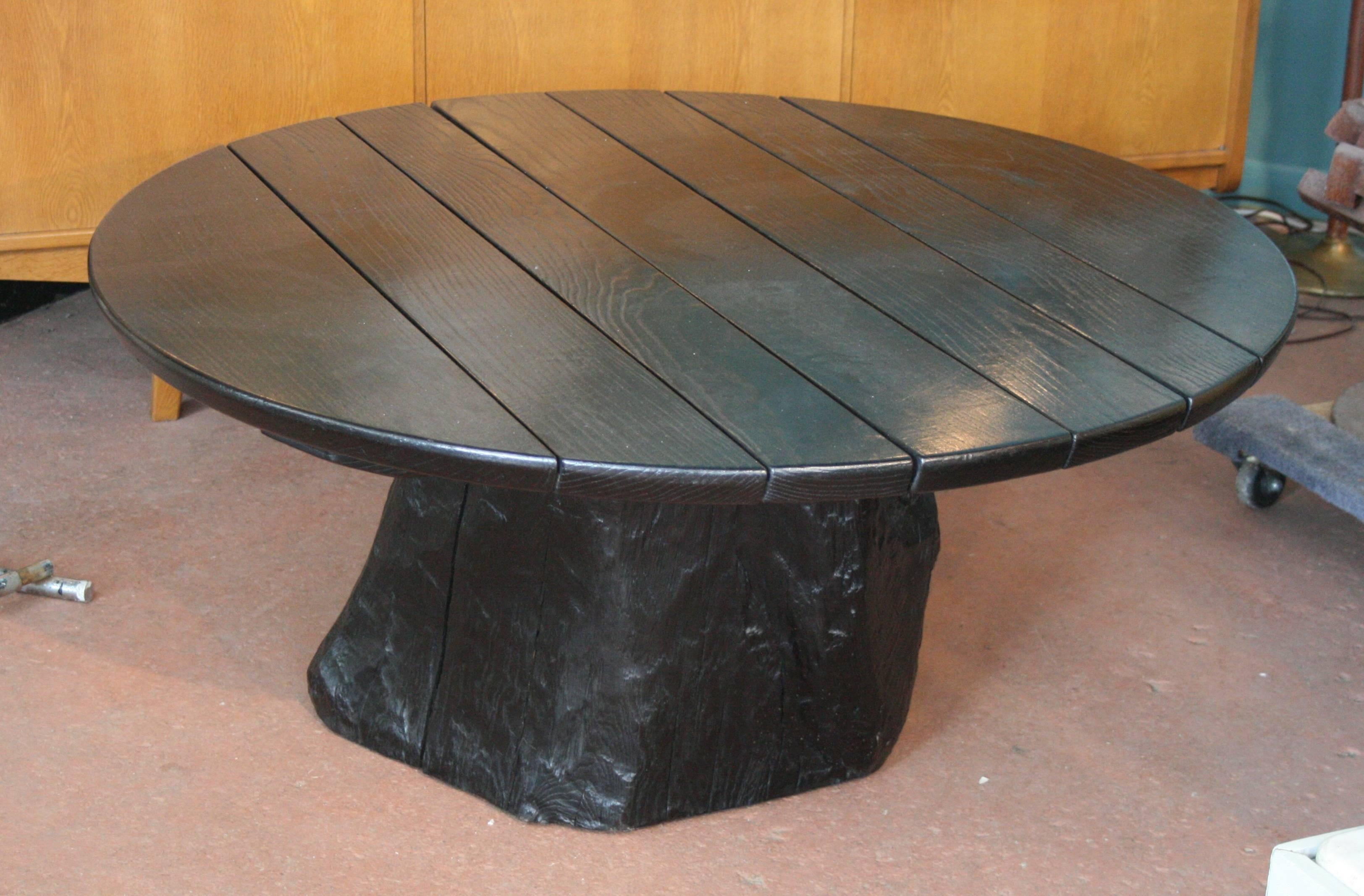 Large round low table with a solid oak plank top and an impressive natural solid tree trunk base.
Avantgarden Ltd. cultivates unexpected and exceptional lighting, furniture and design.  To view items in person please visit our showroom in Pound