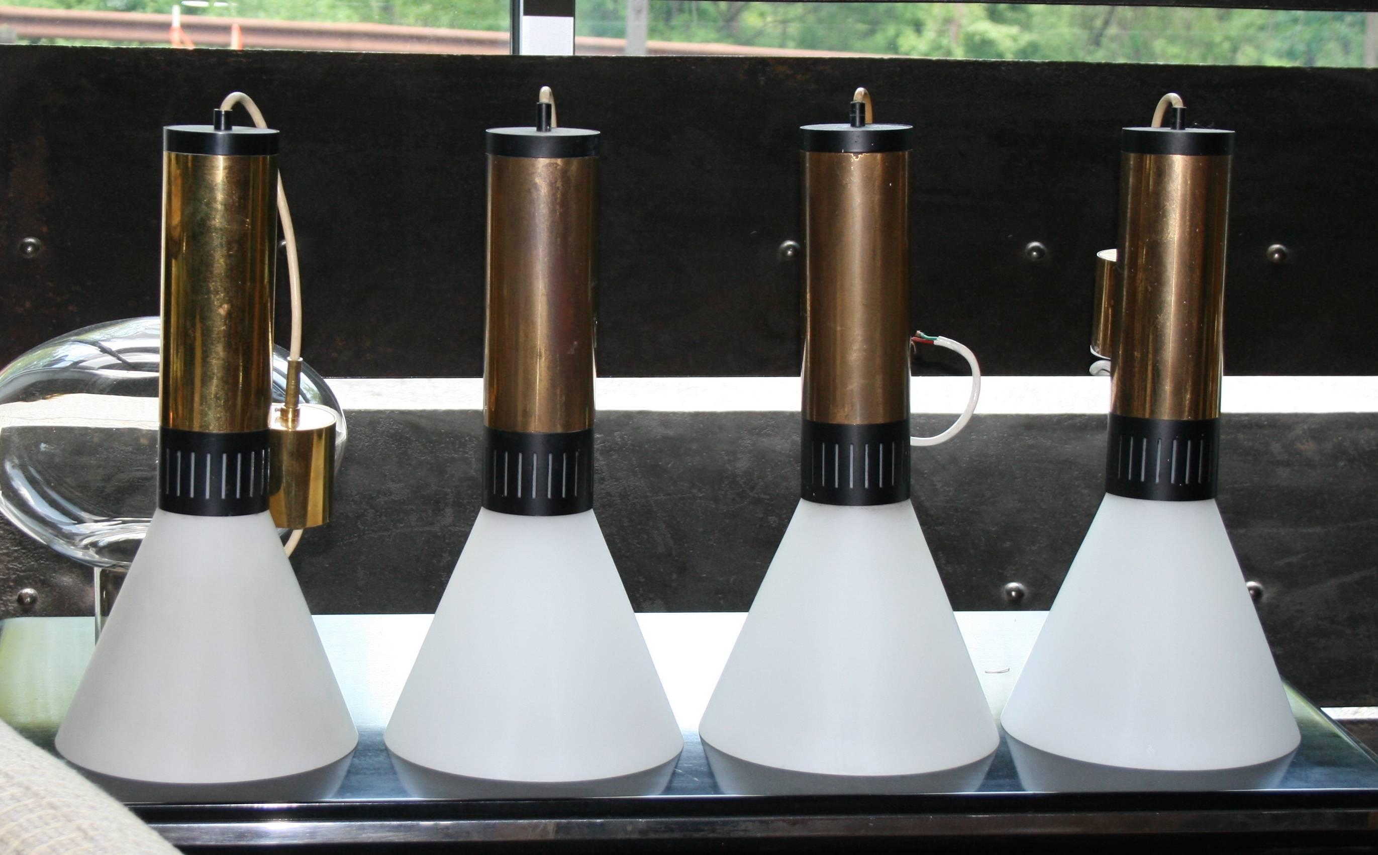 Pair of Stilnovo brass hanging pendant lights with all original opaline glass cone shades; all retaining original brass canopies; high, newly wired.