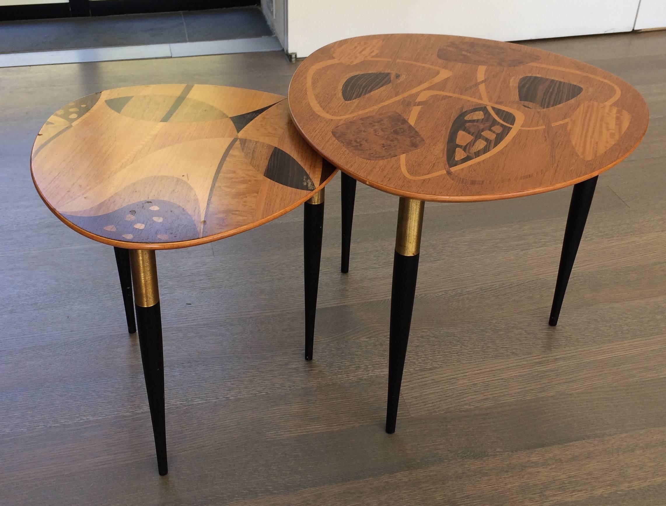 Two exotic wood inlay tables with abstract designs by Erno Fabry, with brass detail, made in Sweden 1953 for Erno Fabry. Larger one is 22