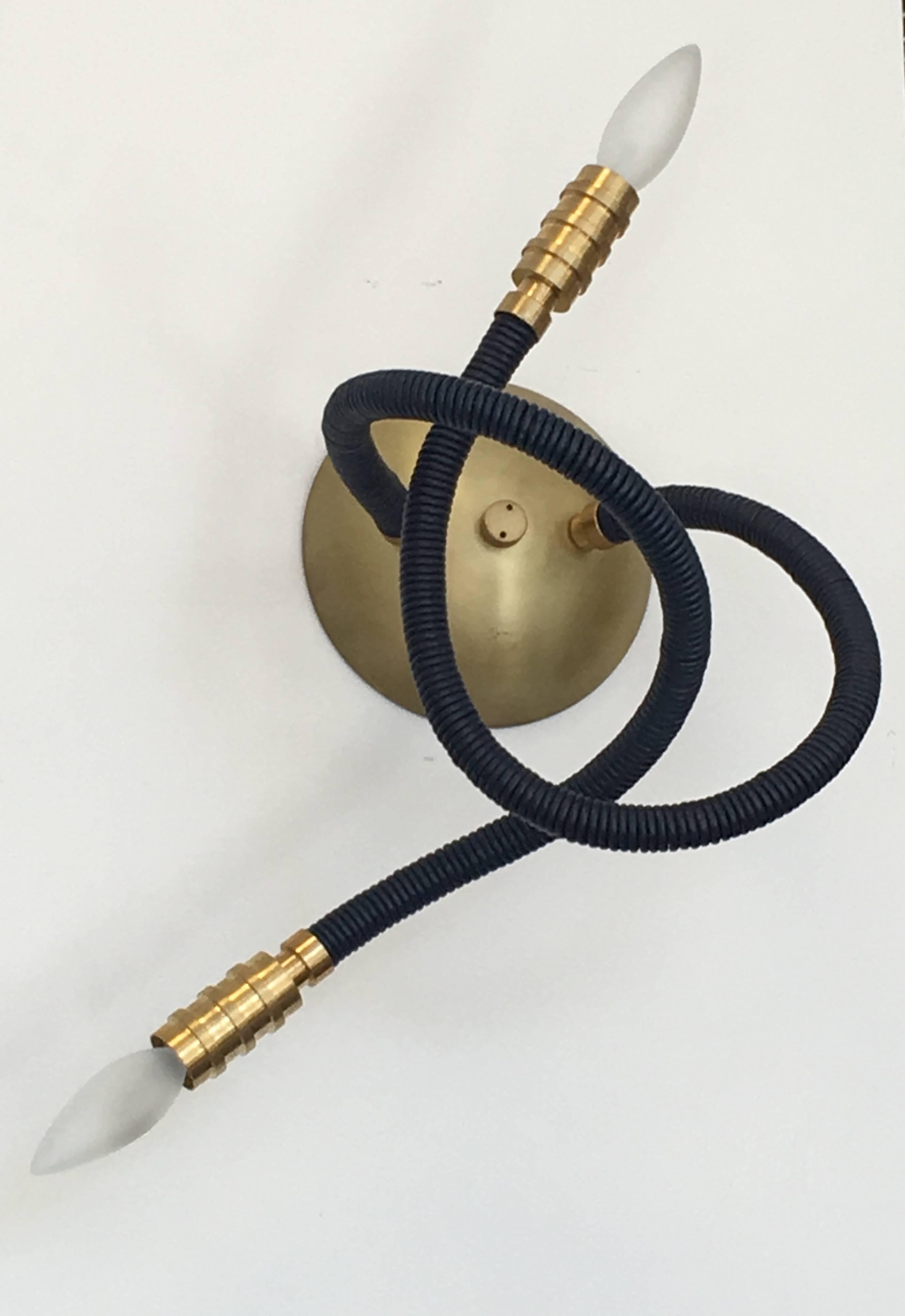 Leather wrapped two-arm sconce with tumbled brass fittings, the flexible arms allow you to adjust and design. Leather and metal options. Measurements are as shown in picture.
Avantgarden Ltd. cultivates unexpected and exceptional lighting, furniture
