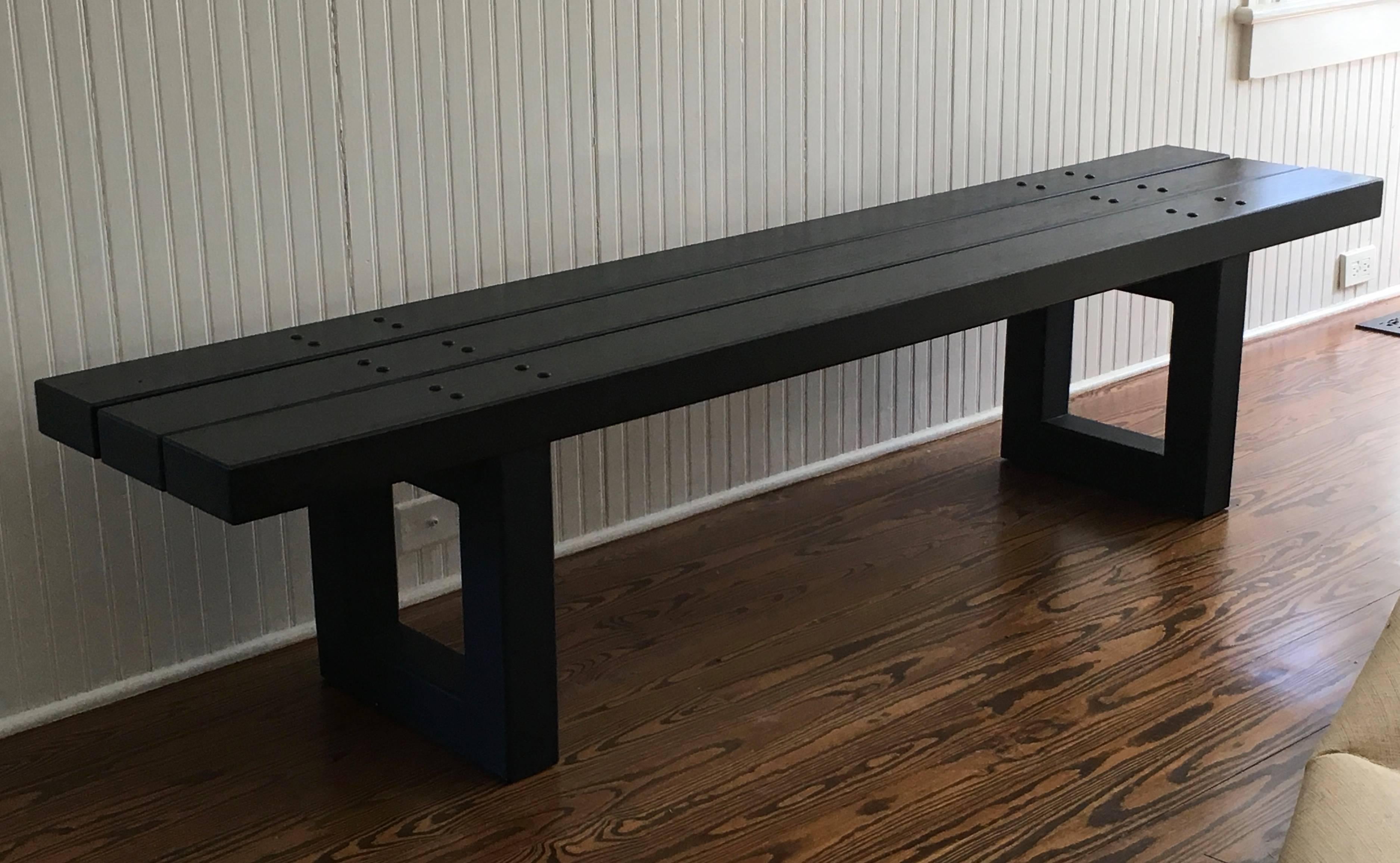 Custom made bench with beautiful bold elements; thick wood planks, shown here in ebonized black finish and blackened steel bases. Custom wood and metal finishes available.