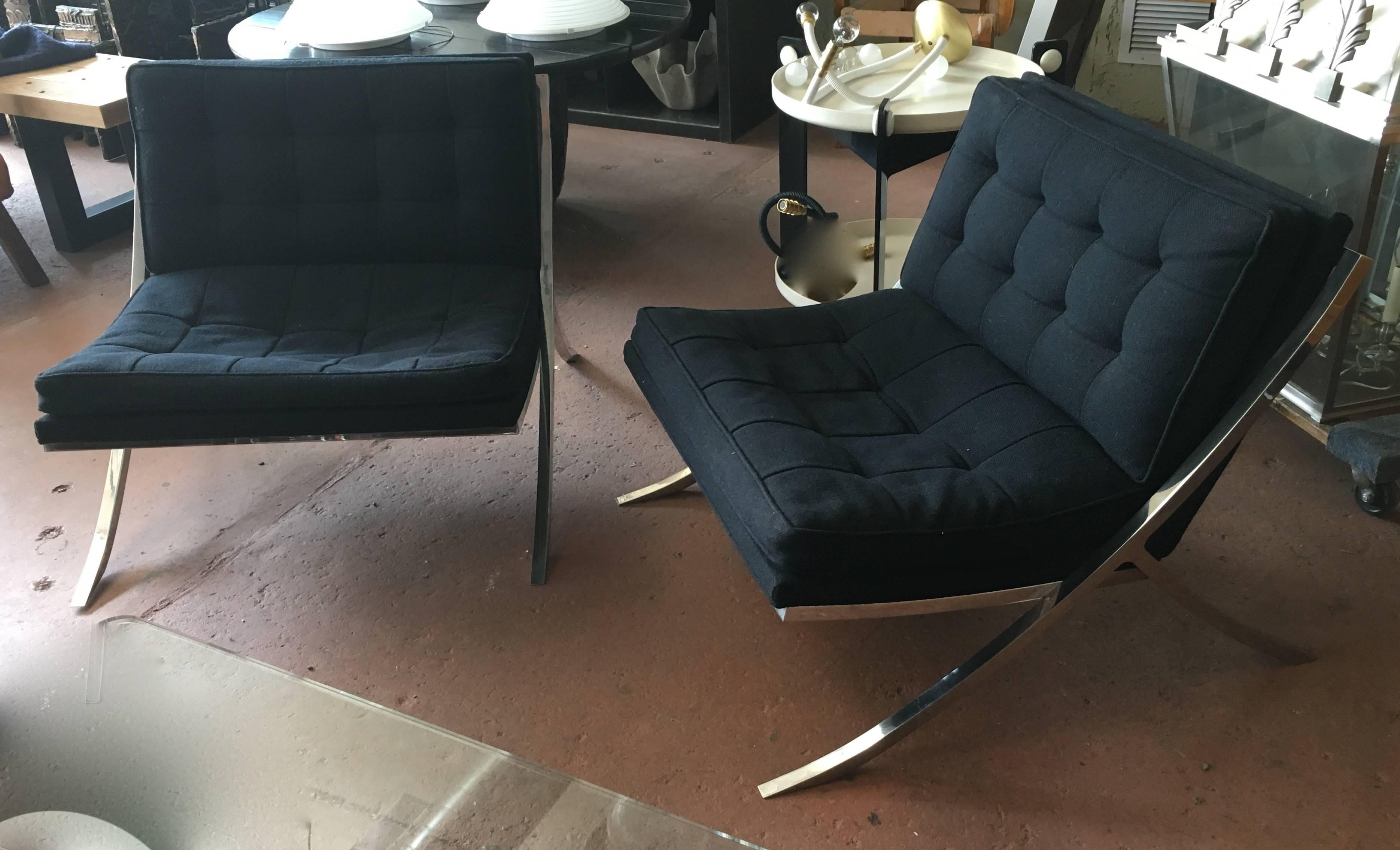 Pair of 1970s polished solid stainless steel lounge chairs with original label Mueller Furniture Co, substantial and heavy. Original black linen upholstery,  reupholstery recommended. Nice alternative to a Barcelona chair.

Avantgarden Ltd.
