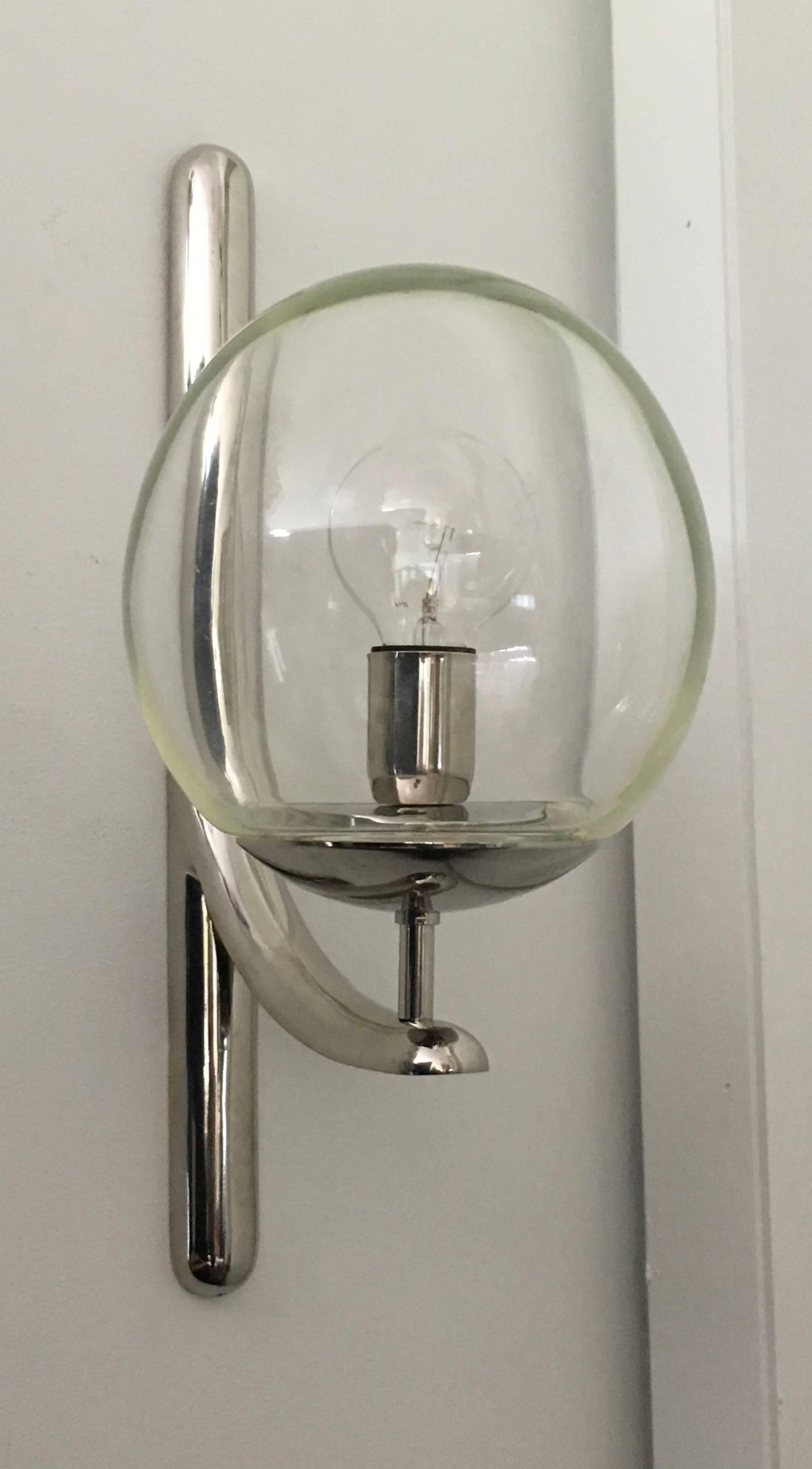 Large-scale chromed cast brass wall lights with handblown glass ball shades; signed Venini Italia 85. 
These are available in two finishes: the original chrome and also in brass. Priced per item.

Avantgarden Ltd. cultivates unexpected and