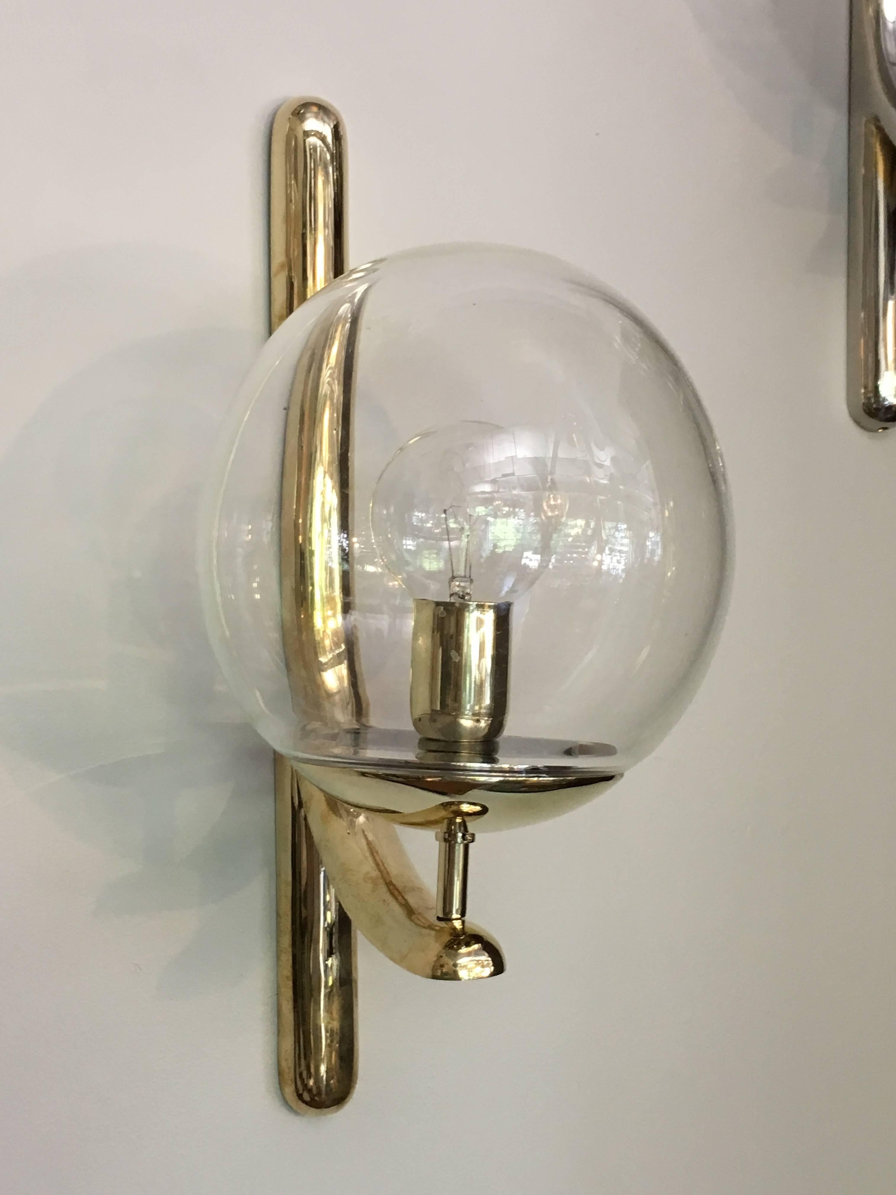 Impressive cast brass wall lights with handblown glass ball shades; signed Venini Italia '85.
These are available in three finishes: the original chrome and also in polished or brushed brass.

Avantgarden Ltd. cultivates unexpected and exceptional