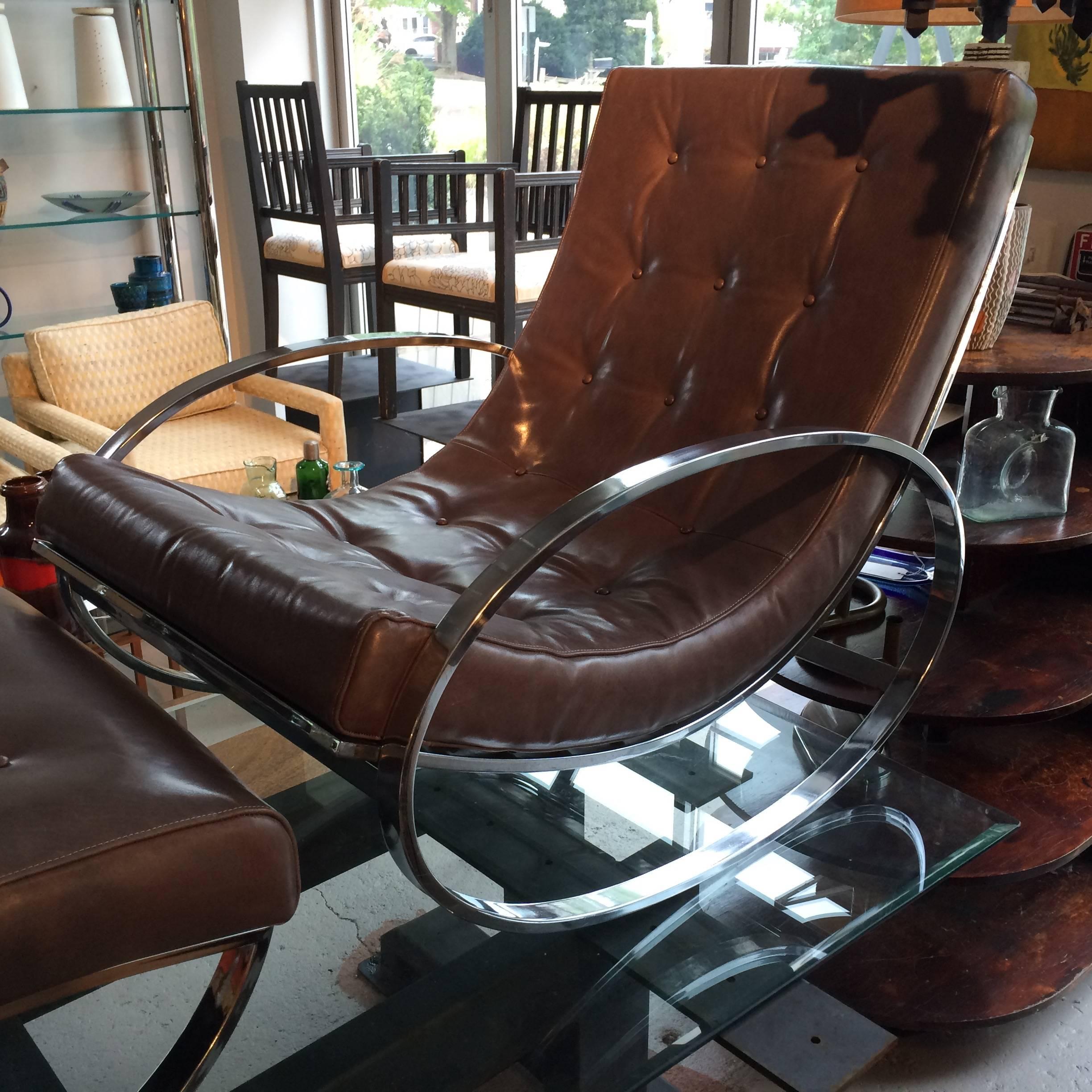Original 1970s Renato Zevi for Selig Ellipse Lounge Chair Rocker and Ottoman; substantial chrome frame; reupholstered in a medium gray leather in excellent condition. 
Measurements are for the chair; rocking foot rest is 27L, 26W, 14H, please