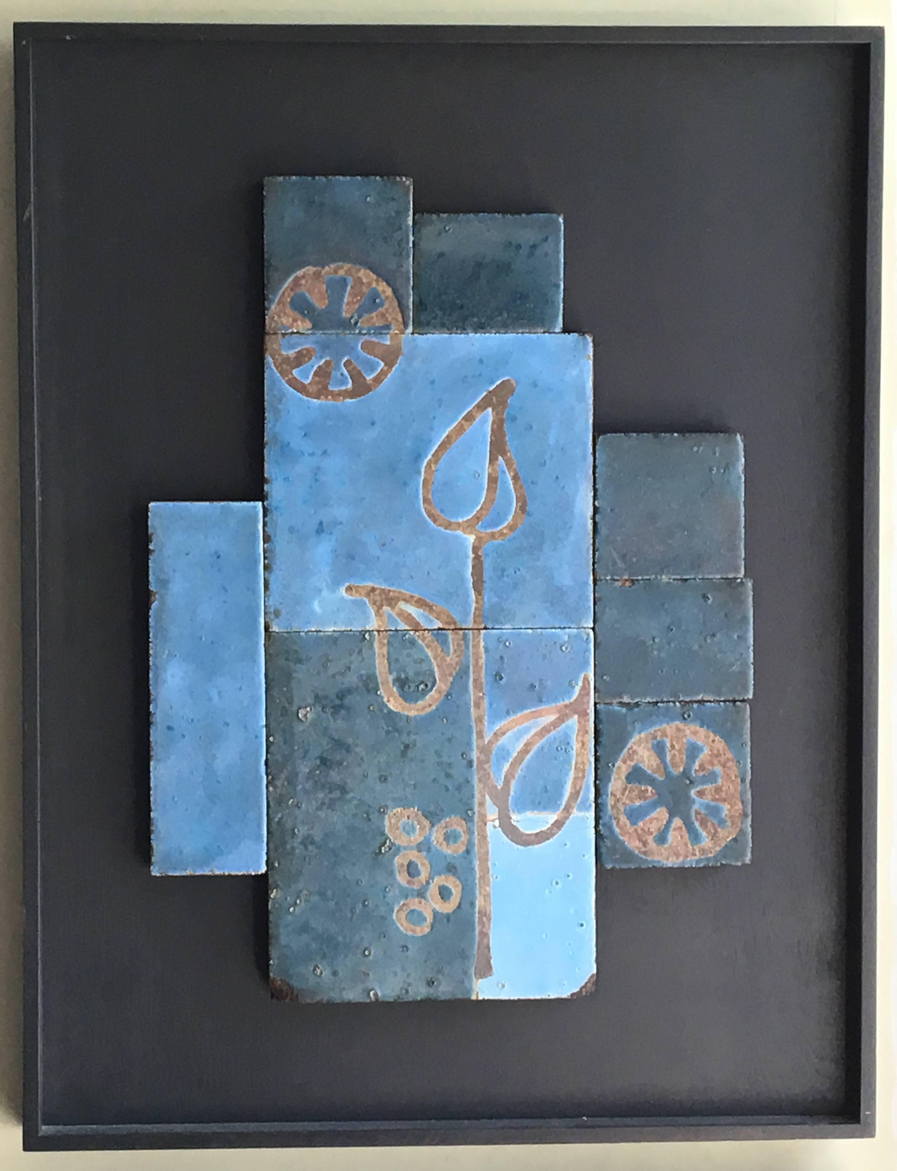 Impressive set of three glazed ceramic tile artworks, all in dreamy blue tones with floral motifs; substantial works, the tiles are mounted onto plywood and then framed in ebonized wood framed panels.

Avantgarden Ltd. cultivates unexpected and