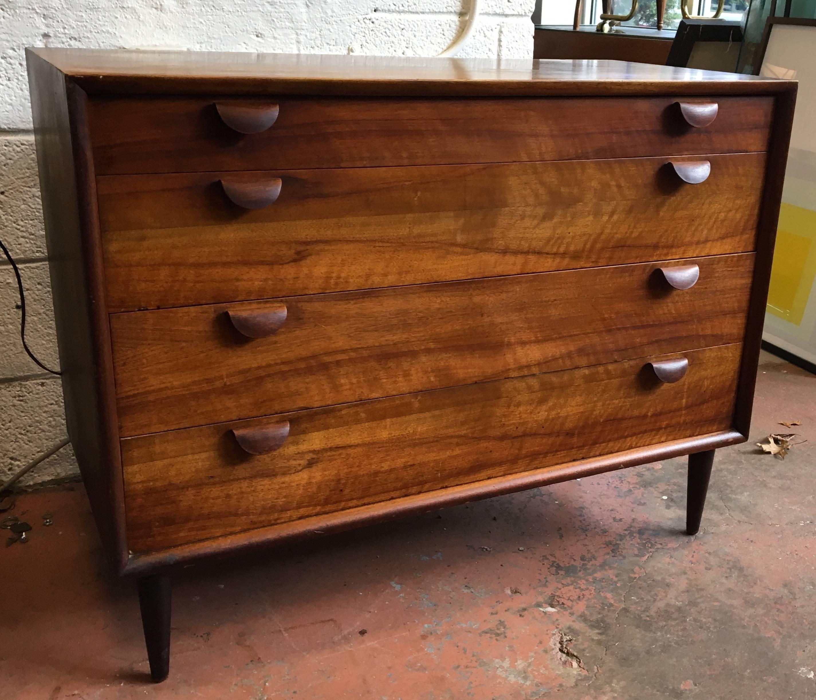 Scandinavian Modern walnut chest of drawers with unusual bent plywood pulls.
Avantgarden Ltd. cultivates unexpected and exceptional lighting, furniture and design. To view items in person please visit our showroom in Pound Ridge, New York.