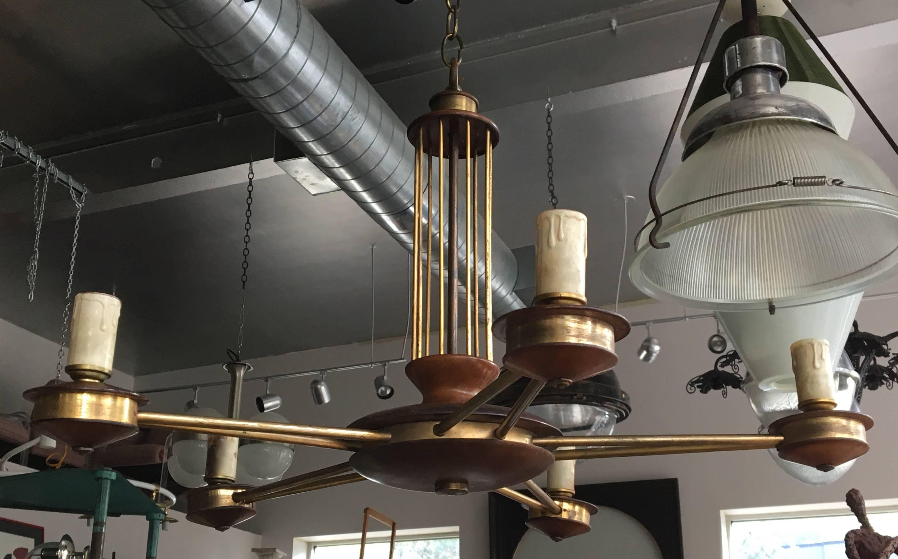 Charming Scandinavian Modern wood and brass chandelier of flush-mounted light, all new wiring included.
Avantgarden Ltd. cultivates unexpected and exceptional lighting, furniture and design. To view items in person please visit our showroom in Pound