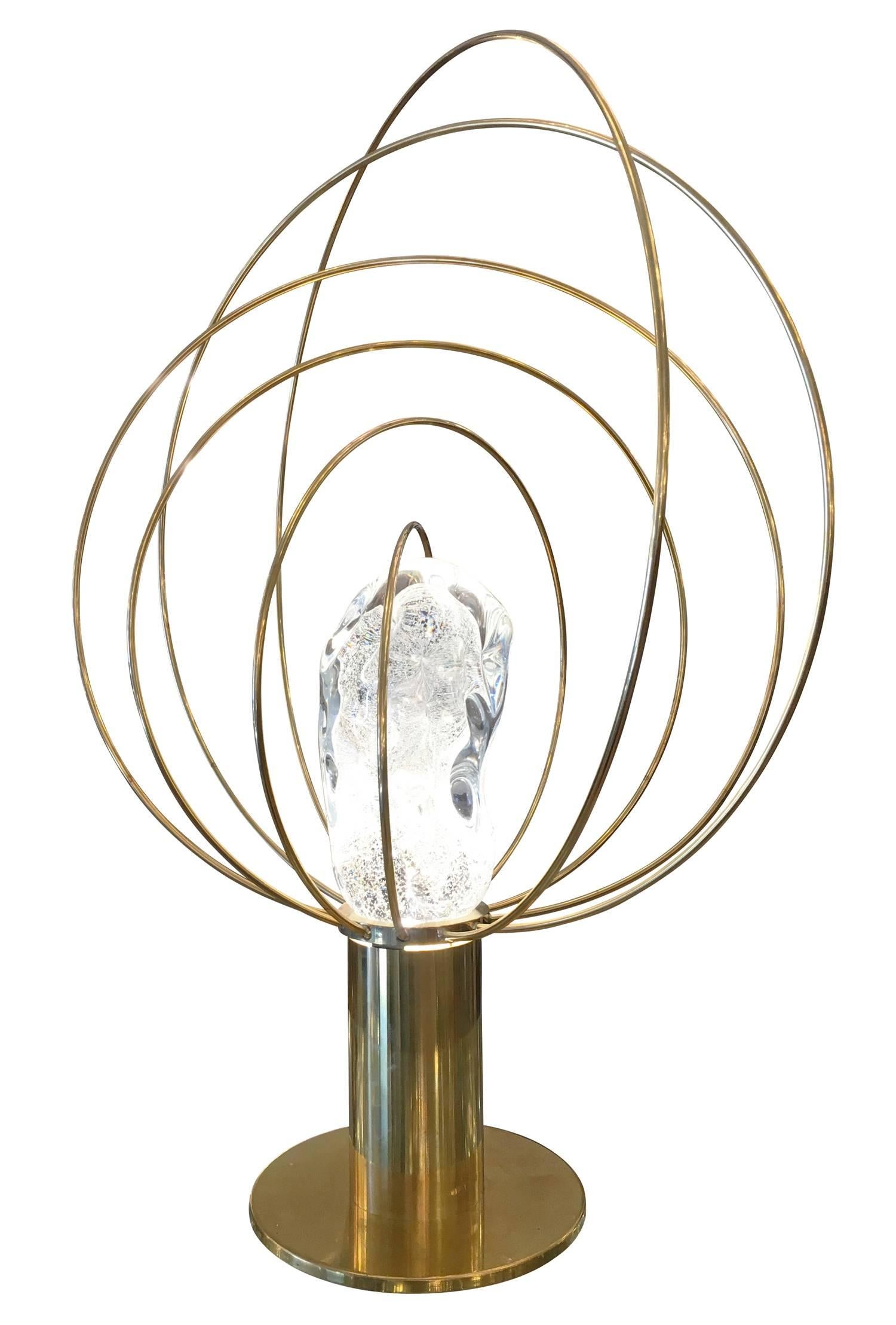 Stunning brass table lamp designed by Angelo Brotto in the 1960s for Italian lighting company Esperia. Exclusively available at Gaspare Asaro-Italian modern, Esperia manufactures them in limited quantities. It features a handmade glass amber incased