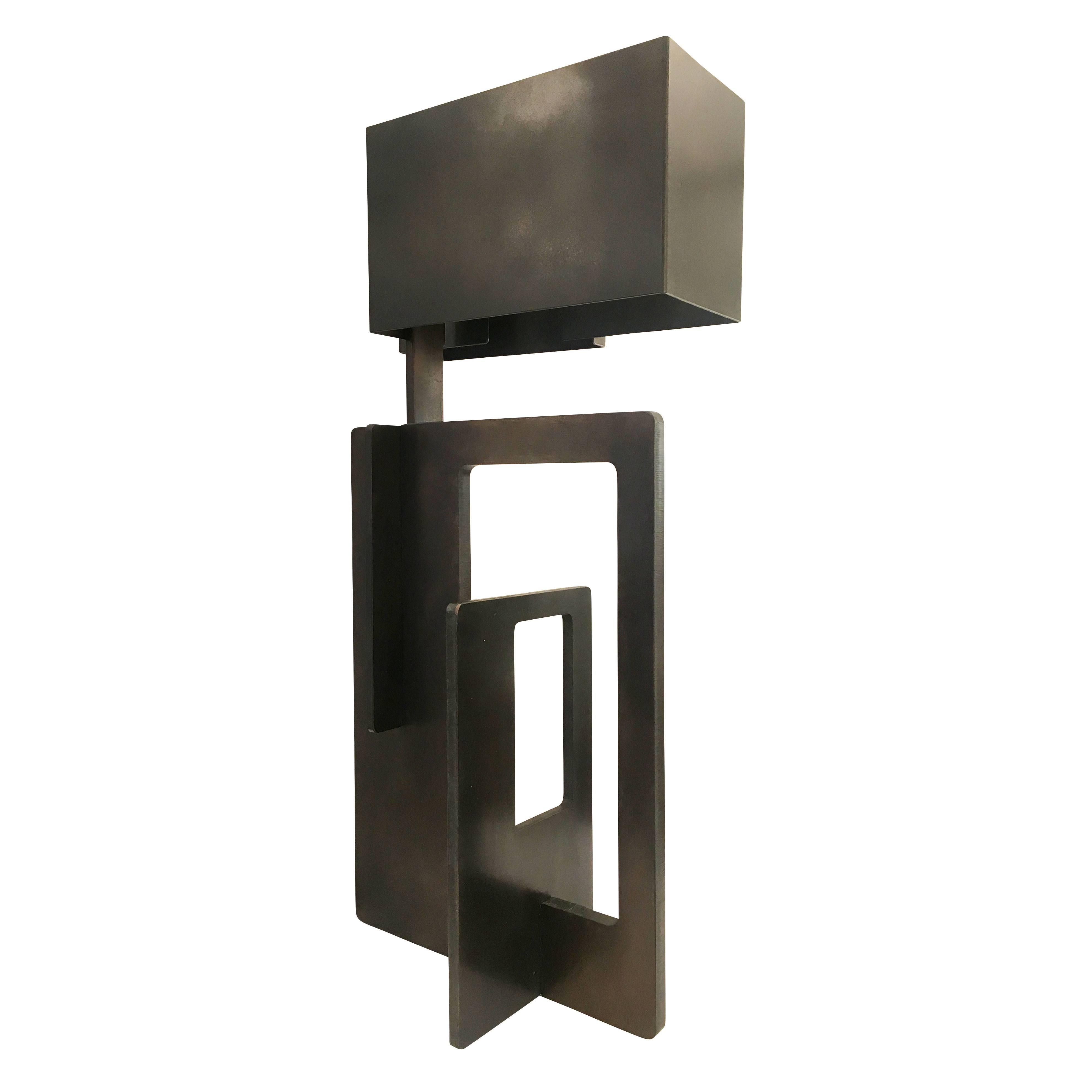 Sculptural iron table lamp finished with an oil rubbed bronze patina. The included shade is also made of Iron. Made by Esperia for Gaspare Asaro.

Measures: Width 13”

Depth 10”

Height 26.5”.