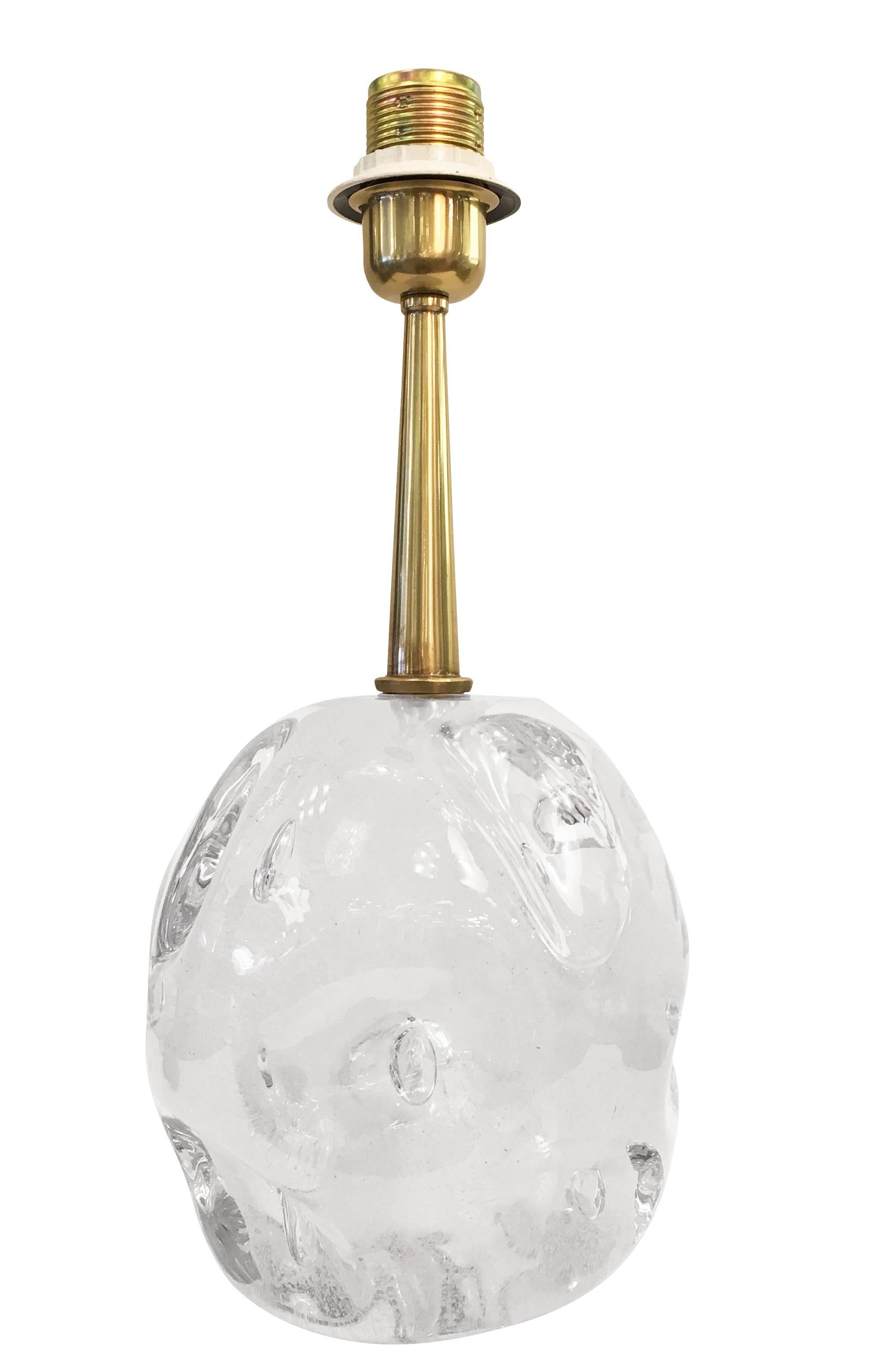 Table lamp manufactured by Esperia for Gaspare Asaro featuring a round hand worked glass amber. The irregular glass is infused with bubbles big and small, giving it an organic feel. Brass hardware. Shade included.

Measures: Diameter: 14” with