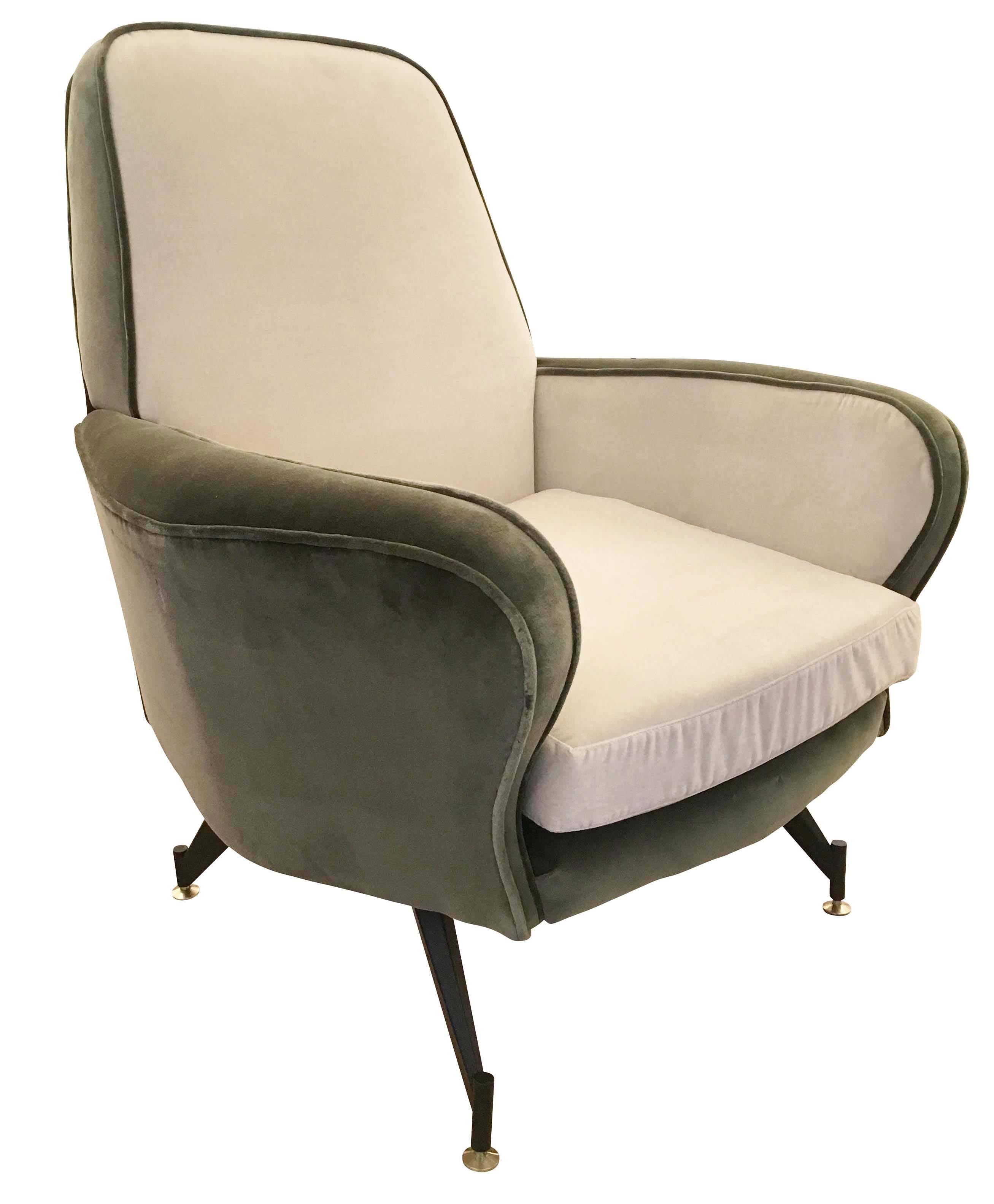 Pair of Italian midcentury lounge chairs attributed to Formanova. Upholstered in a green and off-white velvet. Legs are lacquered black and feet are brass.
