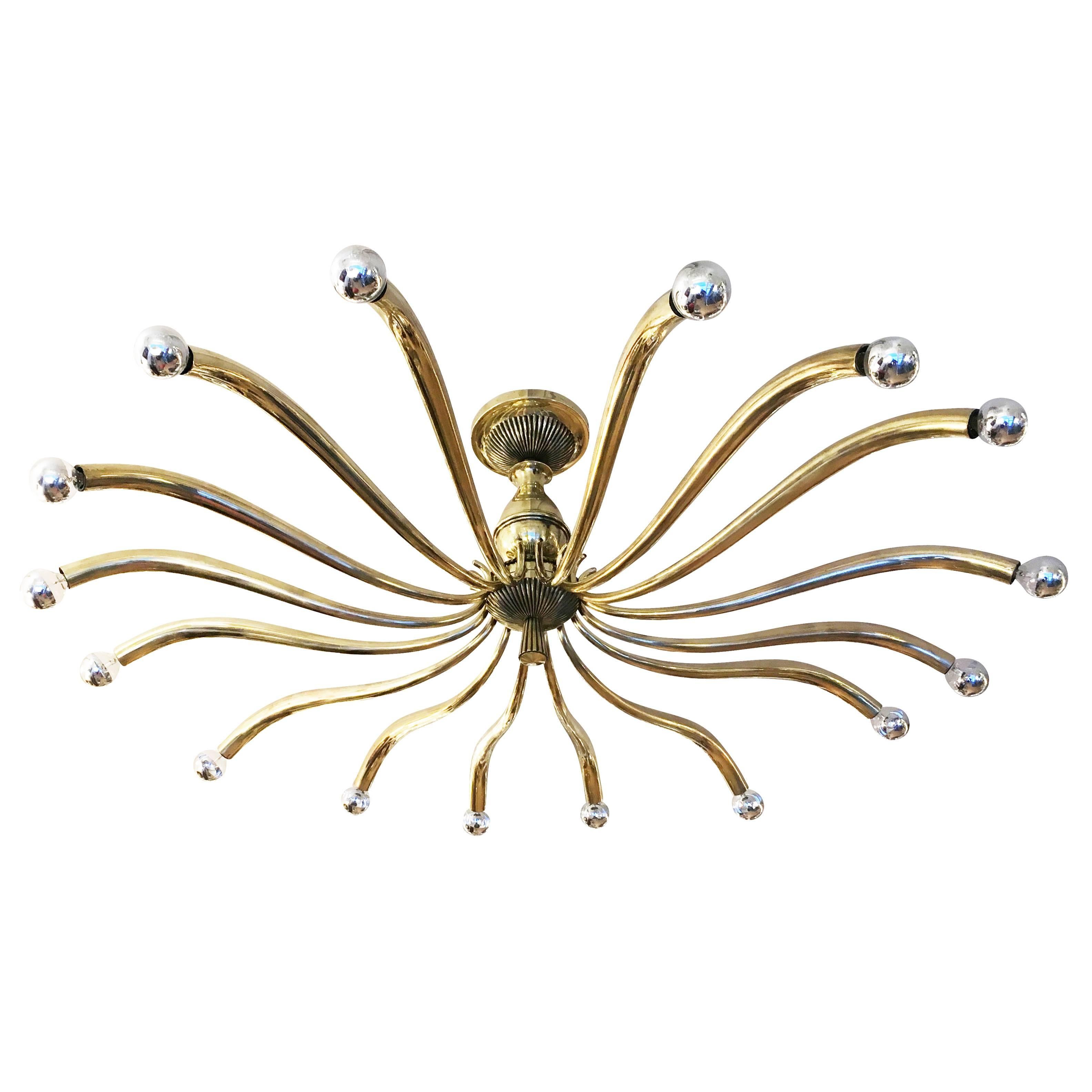 Imposing 1940s, chandelier attributed to Guglielmo Ulrich with fifteen sloping brass arms. Holds fifteen candelabra sockets.

Condition: Excellent vintage condition, minor wear consistent with age and use

Measures: Diameter 48