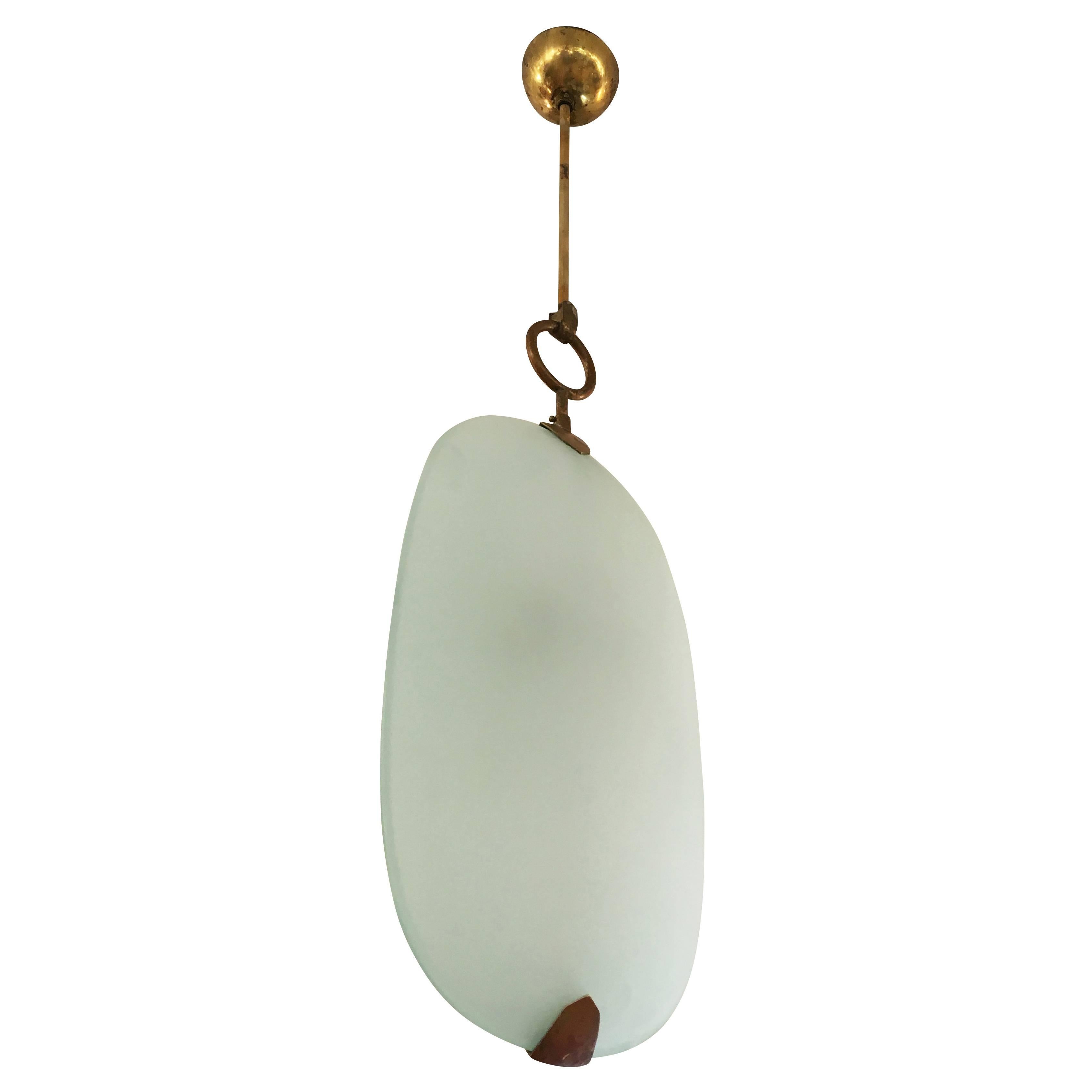 Simple and elegant pendant made by Fontana Arte in the 1960s. The frosted glasses have a slight green tint and rest on a brass frame.

Width: 9