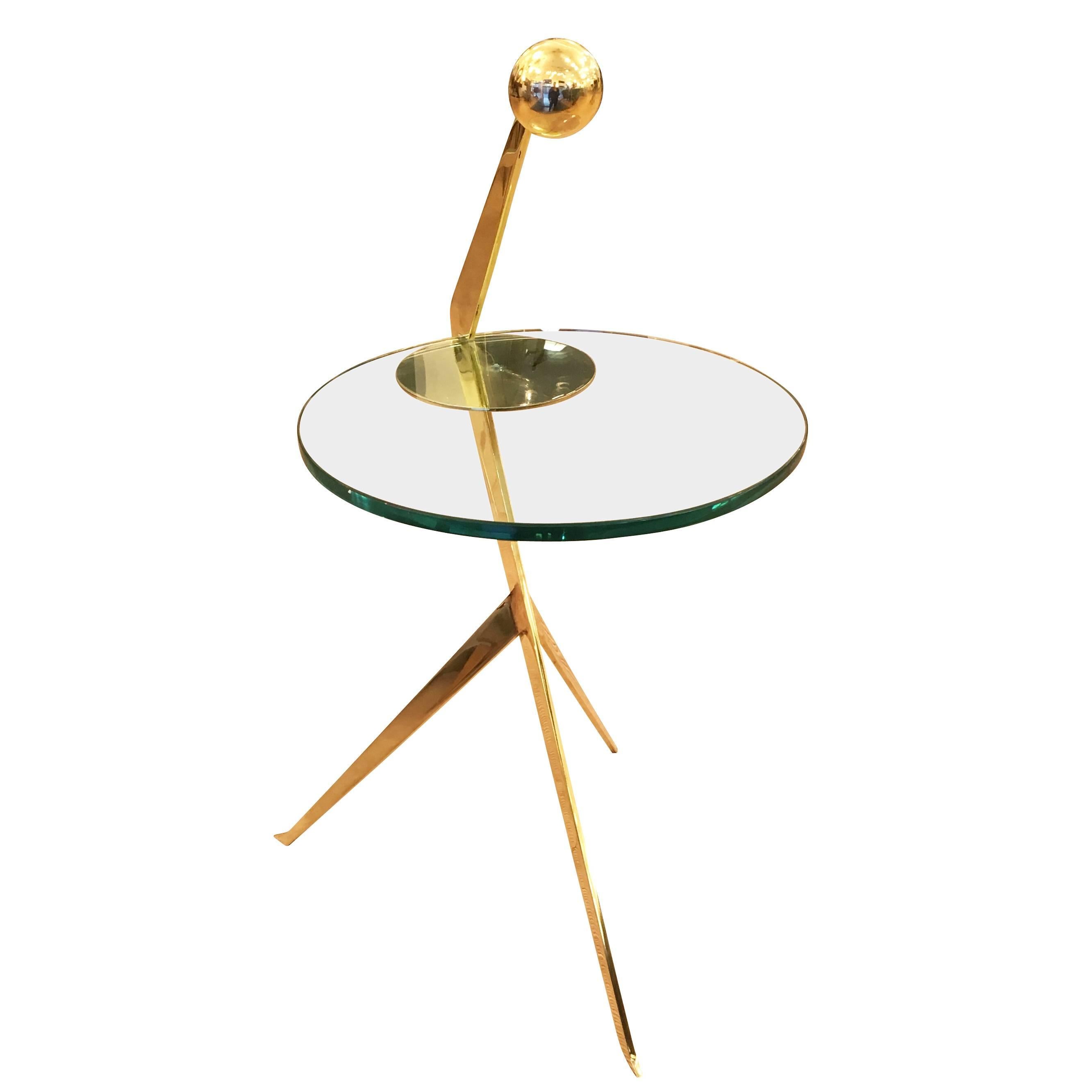 Cantilever side table designed by Gaspare Asaro for formA featuring a thick glass top on a polished brass frame. The brass spherical handle makes it is easy to move around. Finish can be customized.

Measures: Width 14