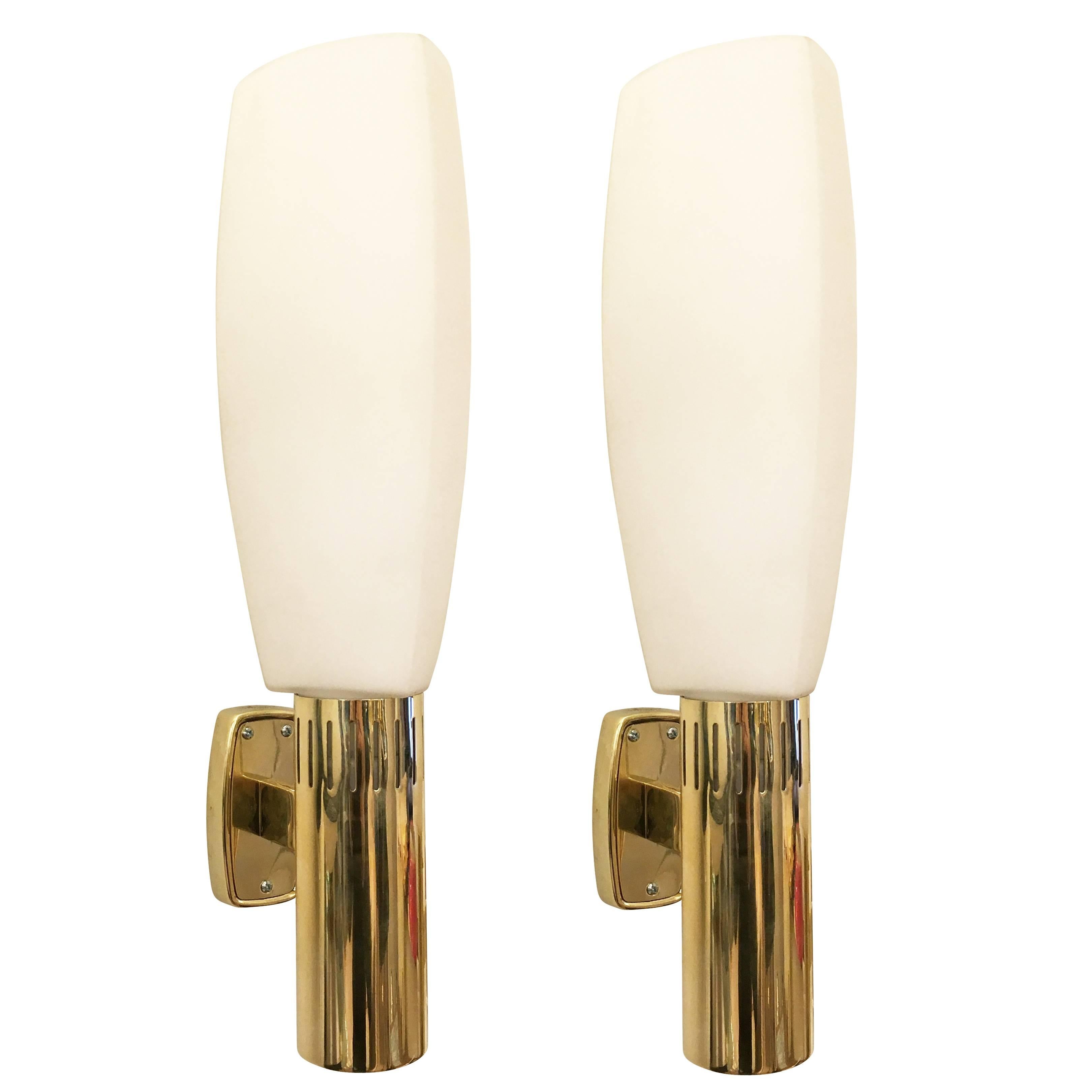 Large Stilnovo sconces with triangular frosted glass shades. Each is marked on the back-plate. Three available. Price per sconce.

Condition: Excellent vintage condition, minor wear consistent with age and use 

Measures Height 17.25
