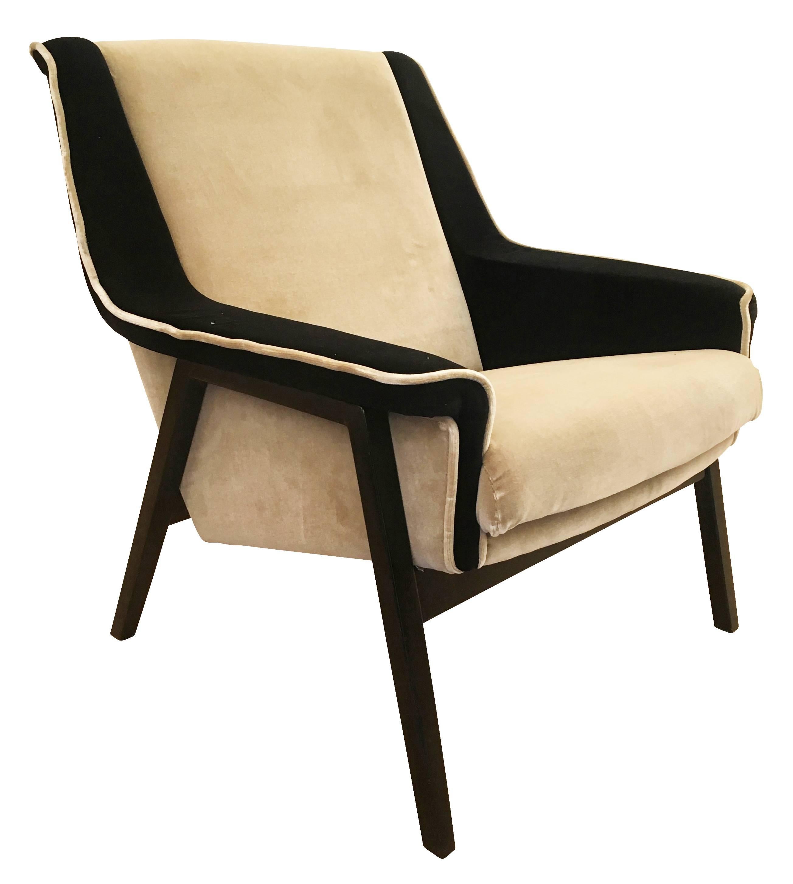 Pair of Italian midcentury armchairs in the manner of Gianfranco Frattini. They have been upholstered in a beige and black velvet. The wood legs are ebony.

Condition: Excellent vintage condition, minor wear consistent with age and use. Minor marks
