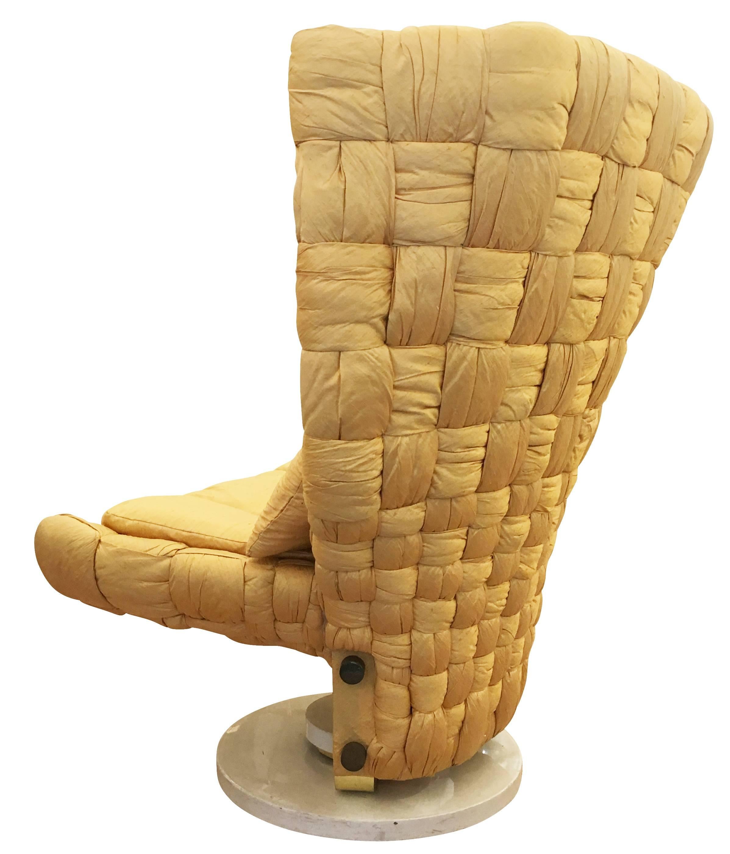 Swivel lounge chair designed by Marzio Cecchi in the 1970s. Upholstered in a woven gold silk. The base is lacquered white with brass details.

Condition: Excellent vintage condition, minor wear consistent with age and use.

Measures: Width