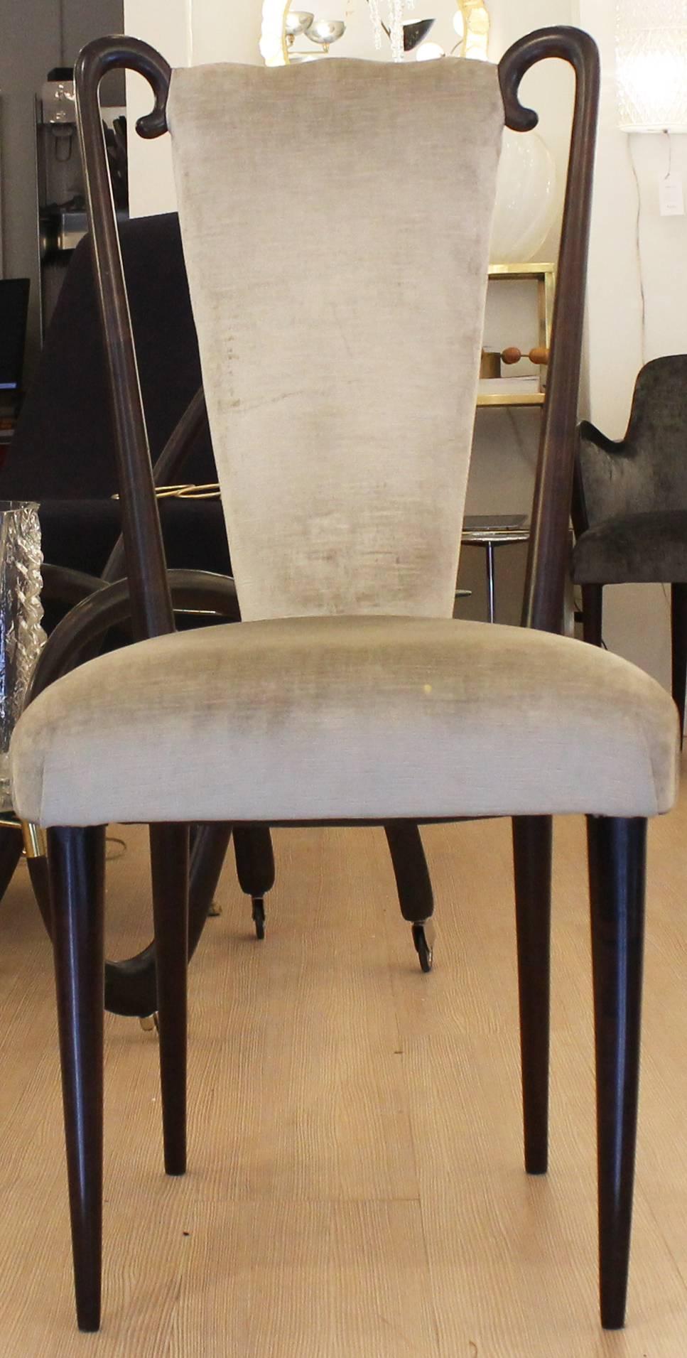 Set of four chairs attributed to Paolo Buffa. They have been reupholstered in a light beige velvet and are very comfortable while the legs have been be done in a dark brown finish. Finish and fabric can be changed upon request.
