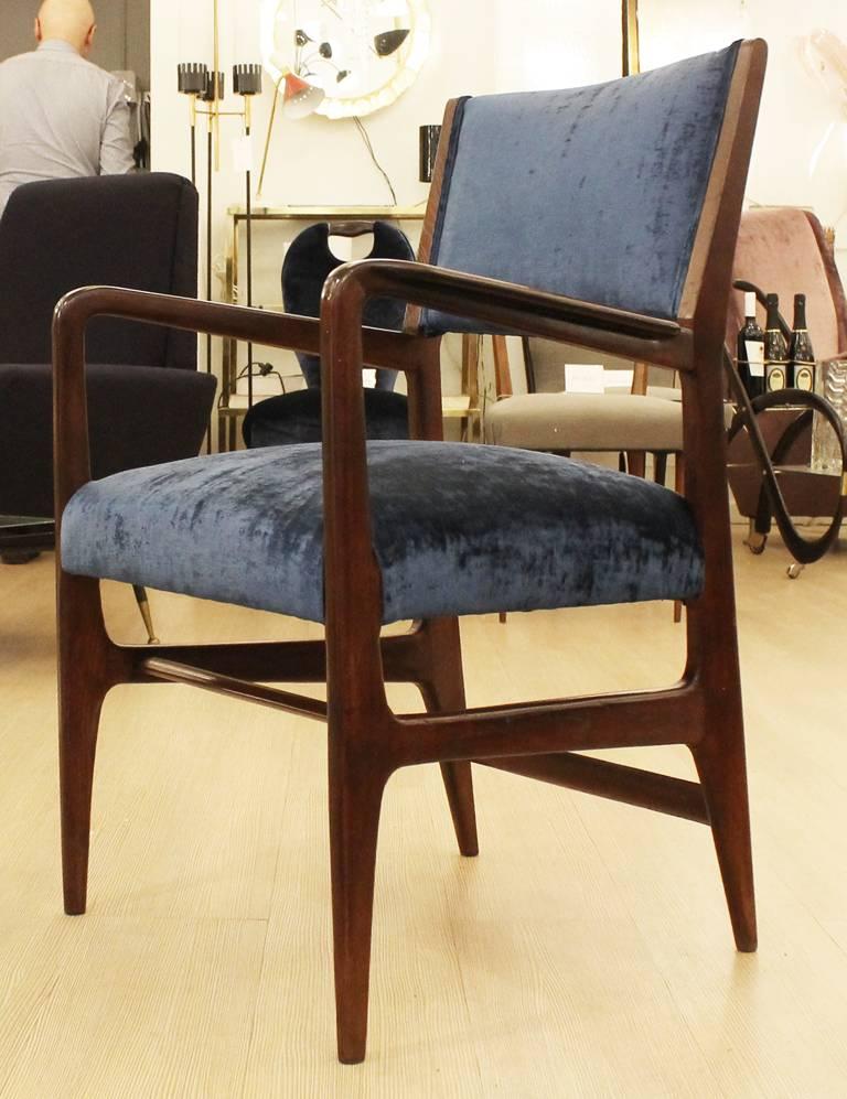 Gio Ponti armchair manufactured by Cassina. Has been re-upholstered in a blue velvet. Fabric can be changed upon request.