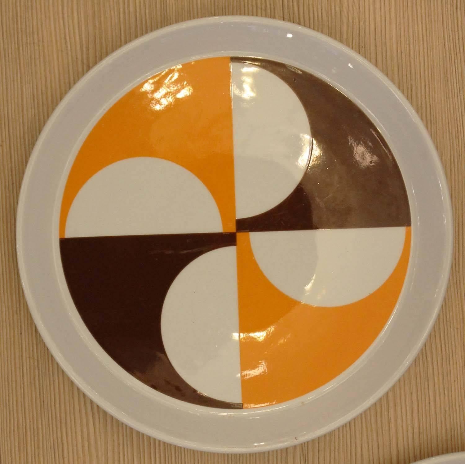 Set of two colorful plates designed by Gio Ponti for Ceramica Franco Pozzi. Label on the back. Perfect for bringing a splash of color to any room. Three separate sets with different designs are available which can be mixed and matched. $500.00 per