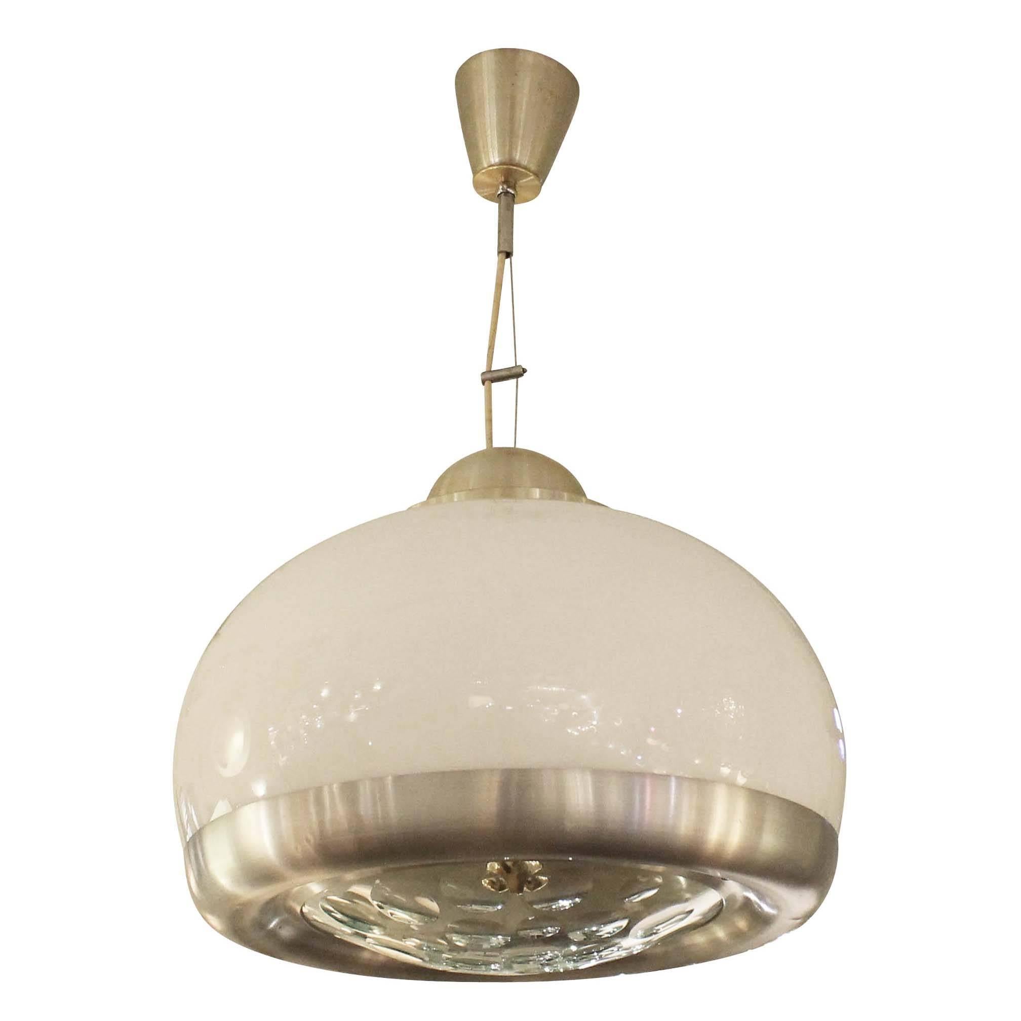 Pendant featuring a thick glass diffuser with rounded facets and white glass body. There is one regular light socket to light the faceted glass and three regular sockets to light the white glass body. Hardware and frame are aluminum. Height can