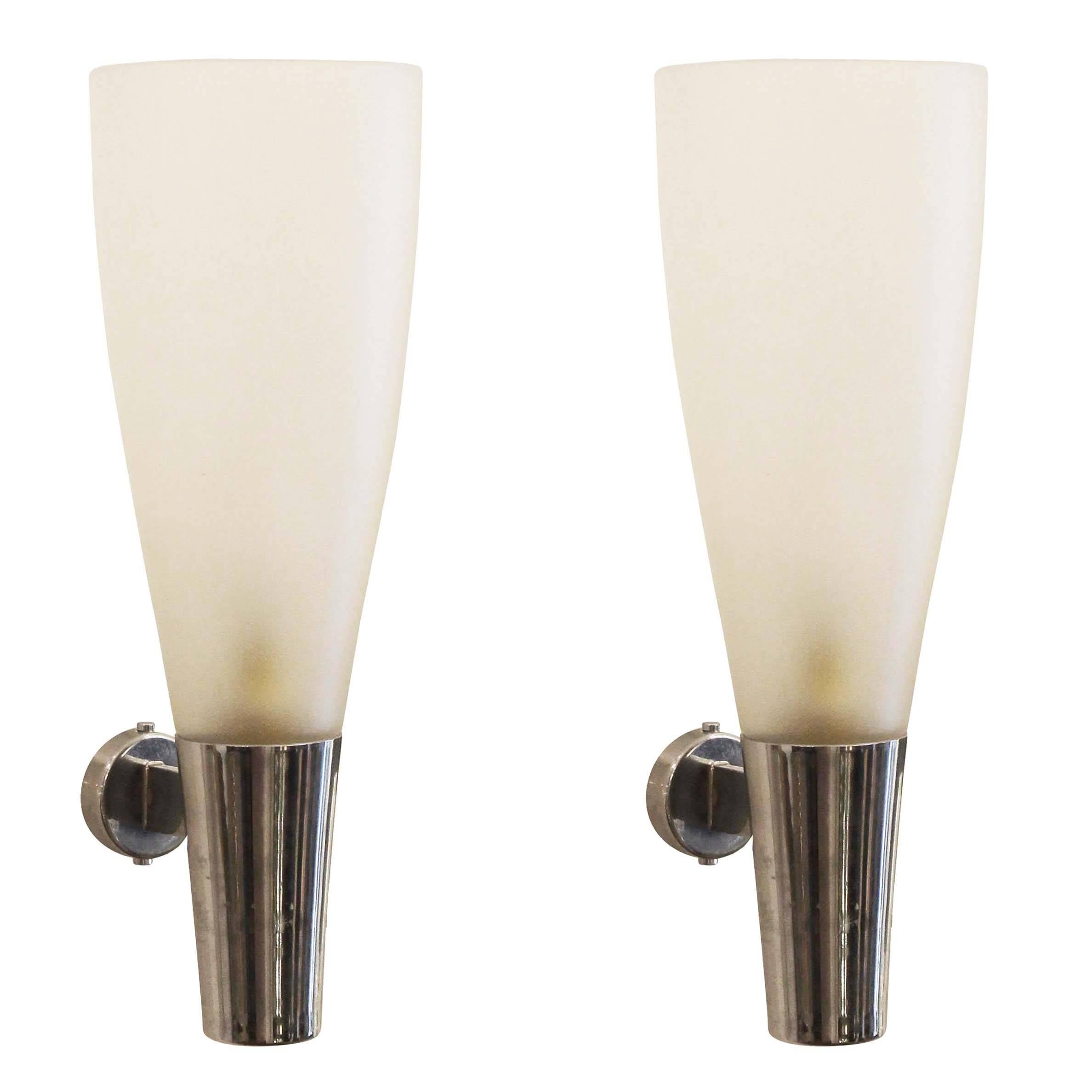 Classic pair of sconces designed by Pietro Chiesa for Fontana Arte in the late 1930s and attributed by some to Gio Ponti. They feature an iridescent frosted glass of superior quality on a chrome base. Both Pietro Chiesa and Gio Ponti designed for