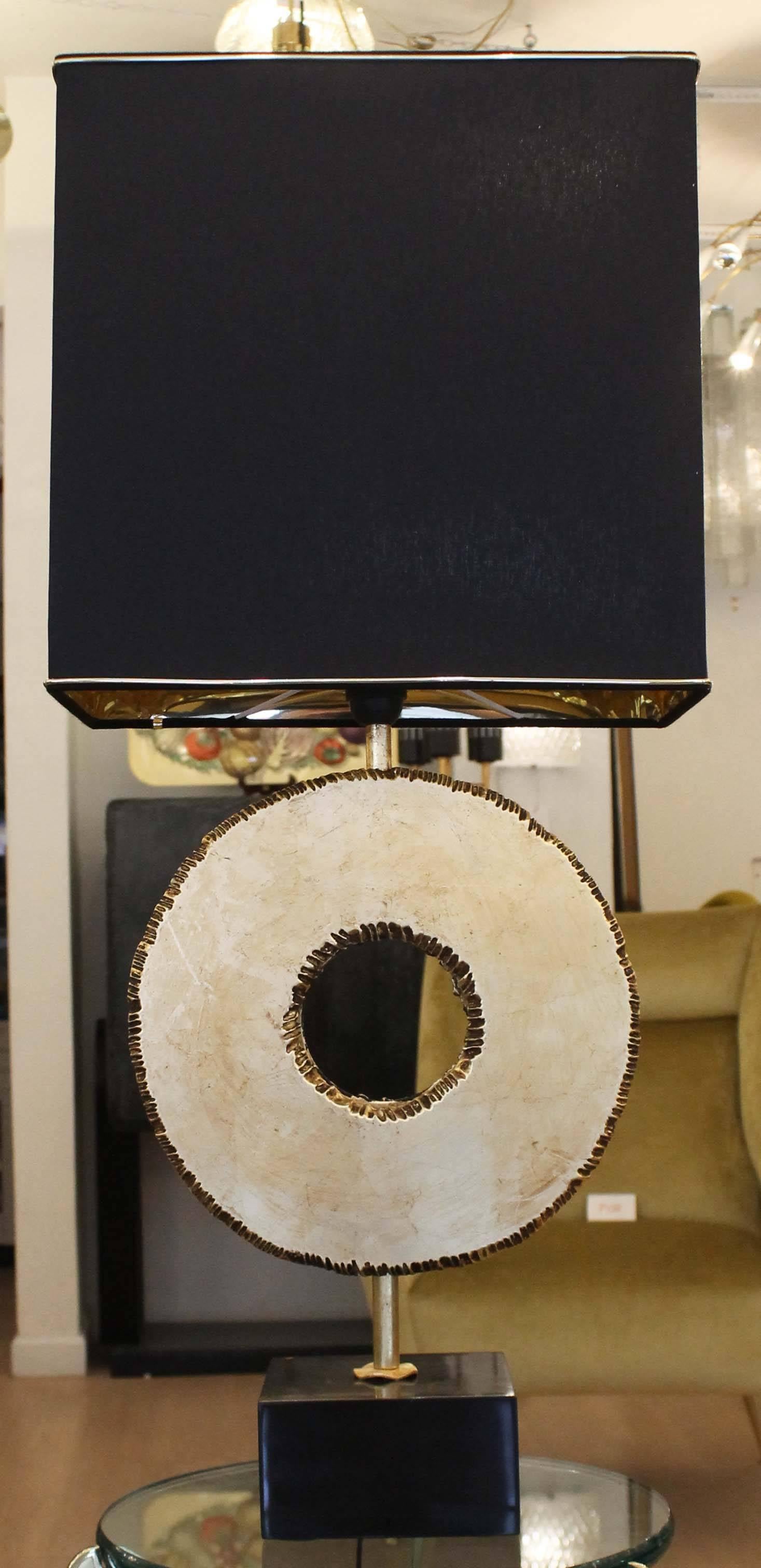 Sculptural pair of metal table lamps finished with gold leaf designed and manufactured by Banci in Florence, Italy. The bases are marble. Each holds one regular socket. The shade is not included in the price and height listed.