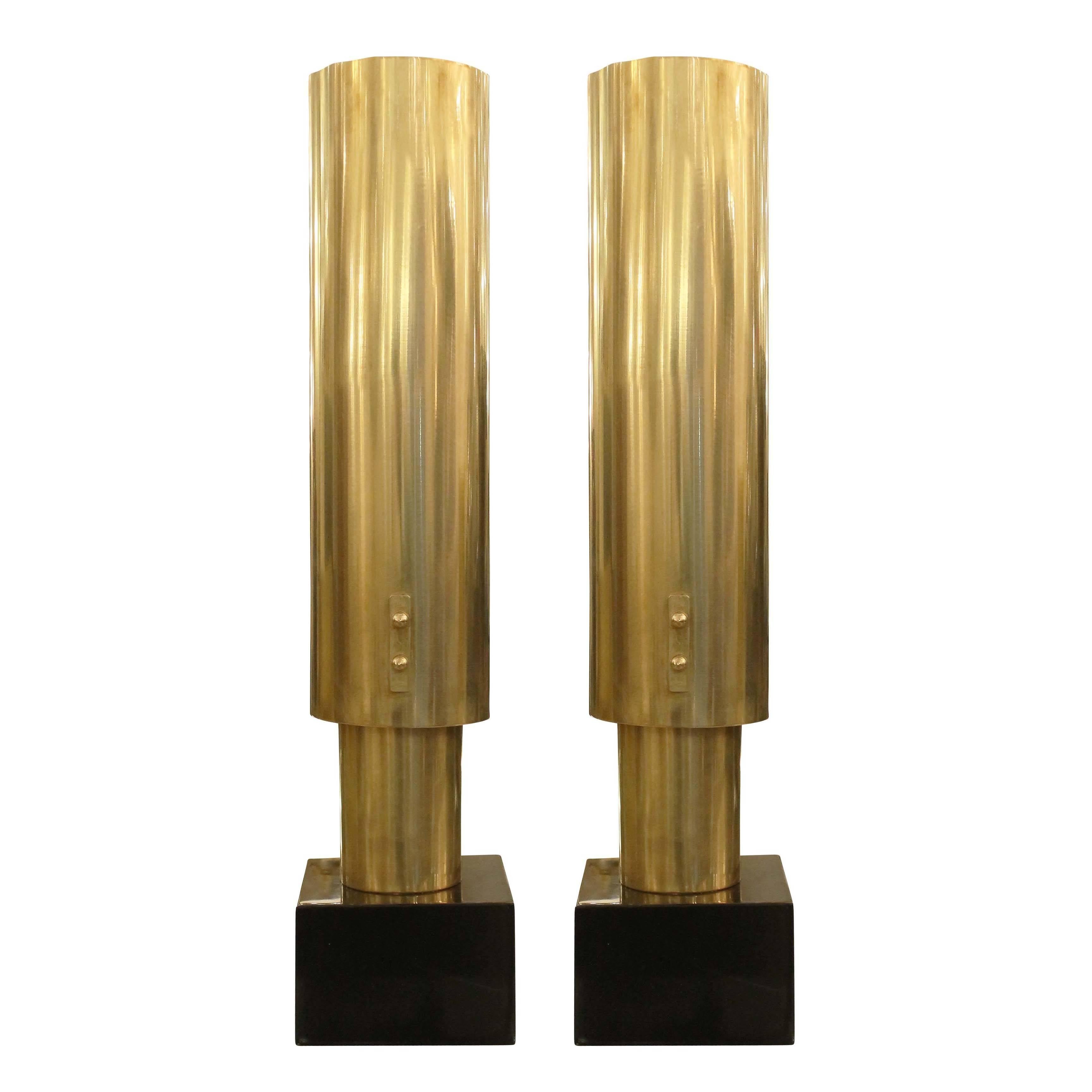 Modern and sleek brass table lamps manufactured in the 1970s by Banci in Florence, Italy. The bases are black marble and each holds on regular socket.