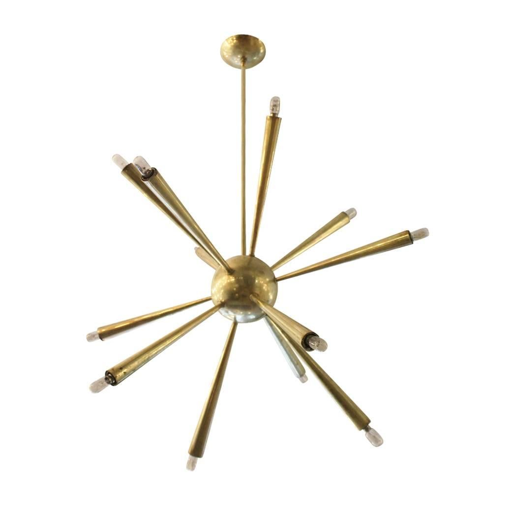Elegant brass Sputnik from the early 1950s. The central body is made from one cast piece showing the high level of craftsmanship. Possibly made by Lumi.