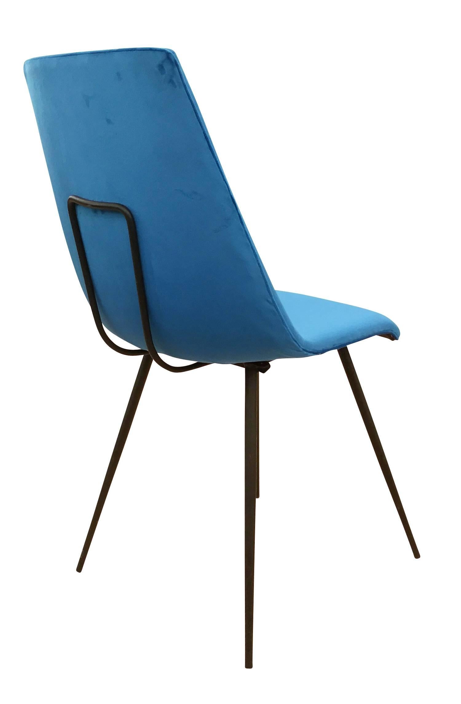 Set of six simple yet sophisticated Italian dining chairs from the the 1950s. The frame is lacquered black. Only one has been re-upholstered in a blue velvet for display purposes. Please contact us for upholstery options.
