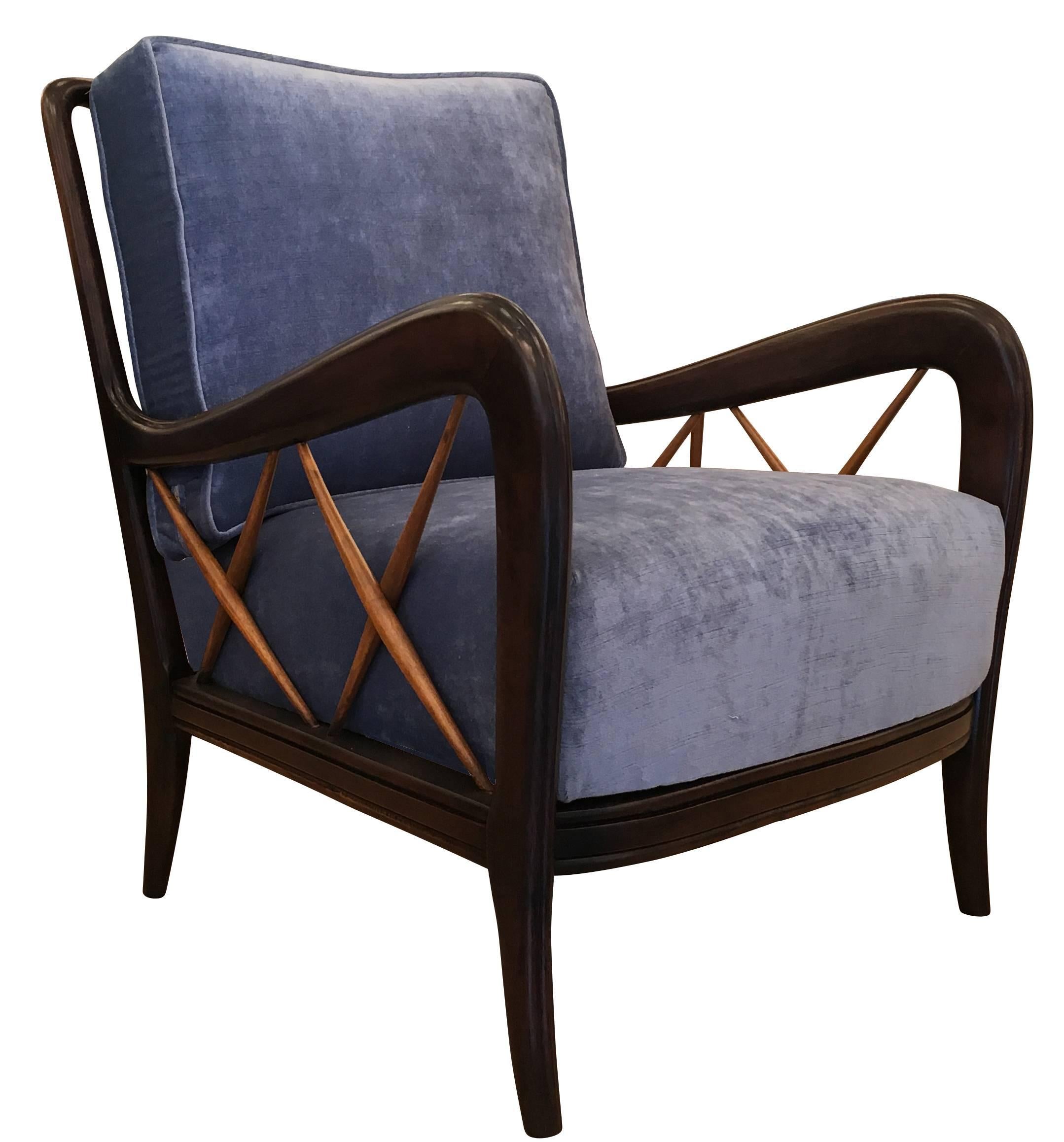 Pair of lounge chairs attributed to Paolo Buffa featuring some beautiful wood work on the sides and back. The outer part of the frame has been finished in a dark color while the 