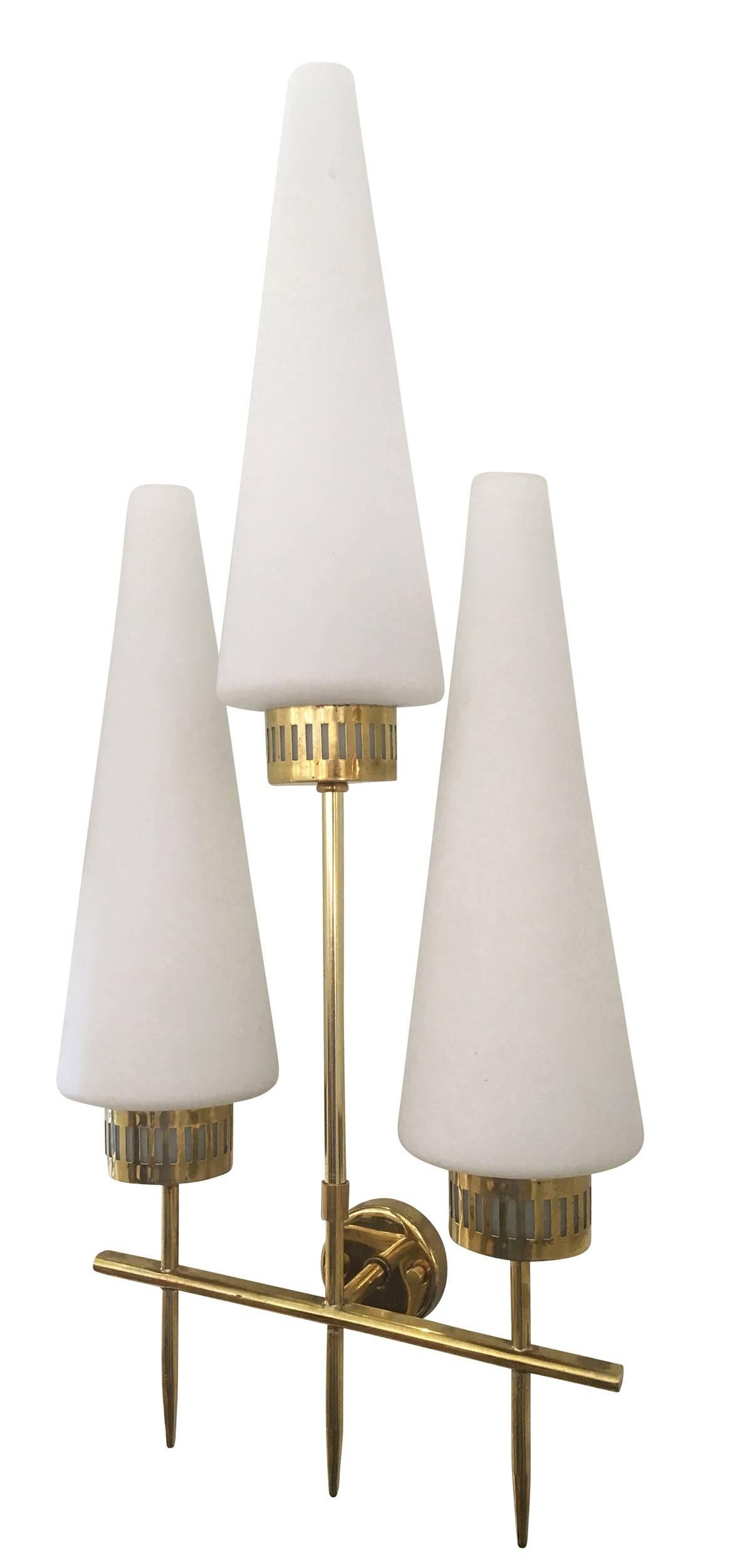 Pair of large 1960s sconces composed of three frosted glass conical shades on a brass frame.
